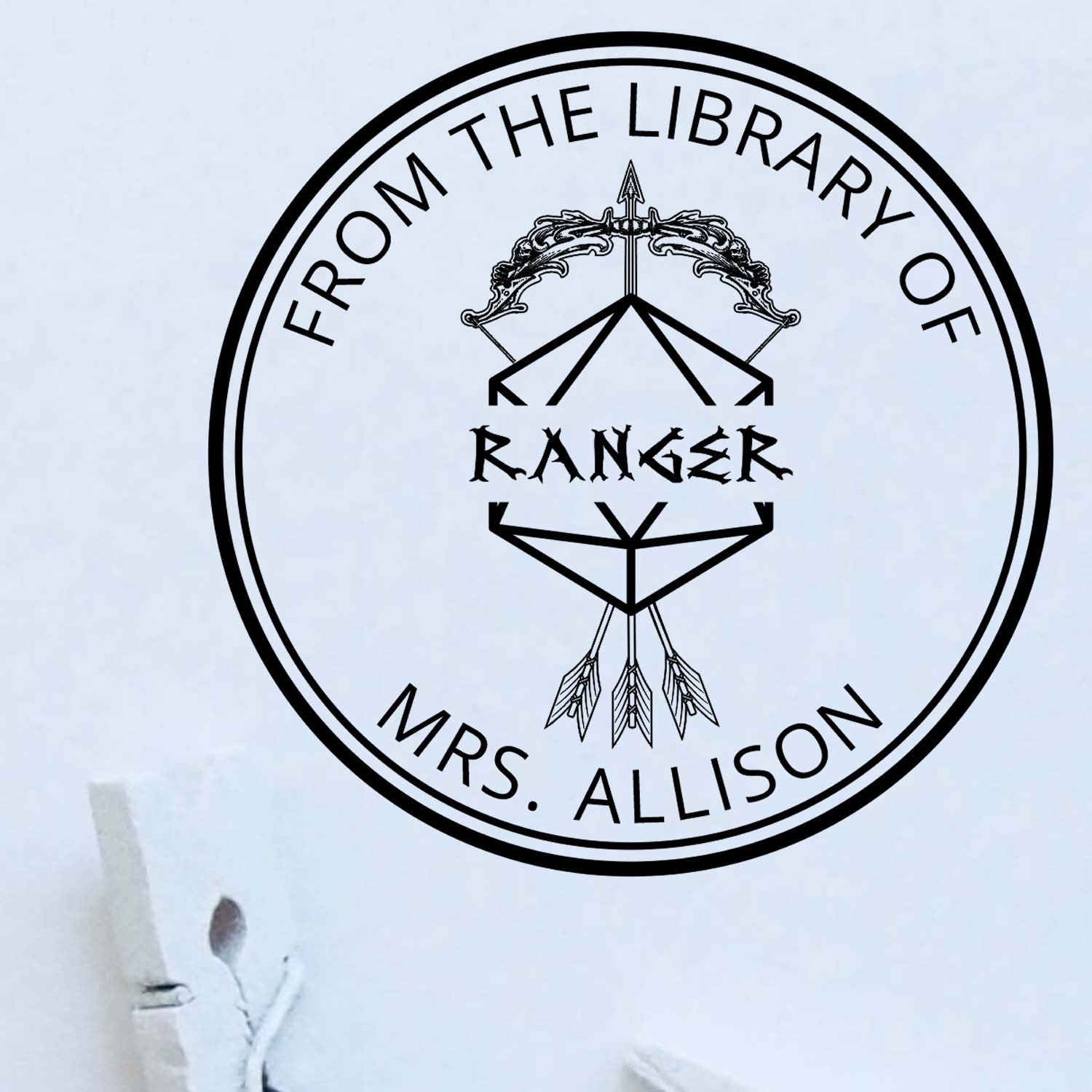 Black circular library stamp seal with From the Library of Mrs. Allison and Ranger text on a white background.