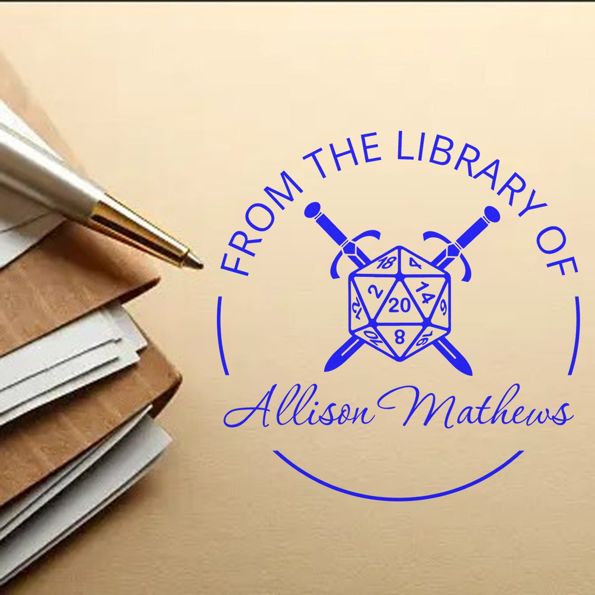 Blue personalized library stamp and seal with dice and crossed swords, reading Allison Mathews, beside a pen and papers.