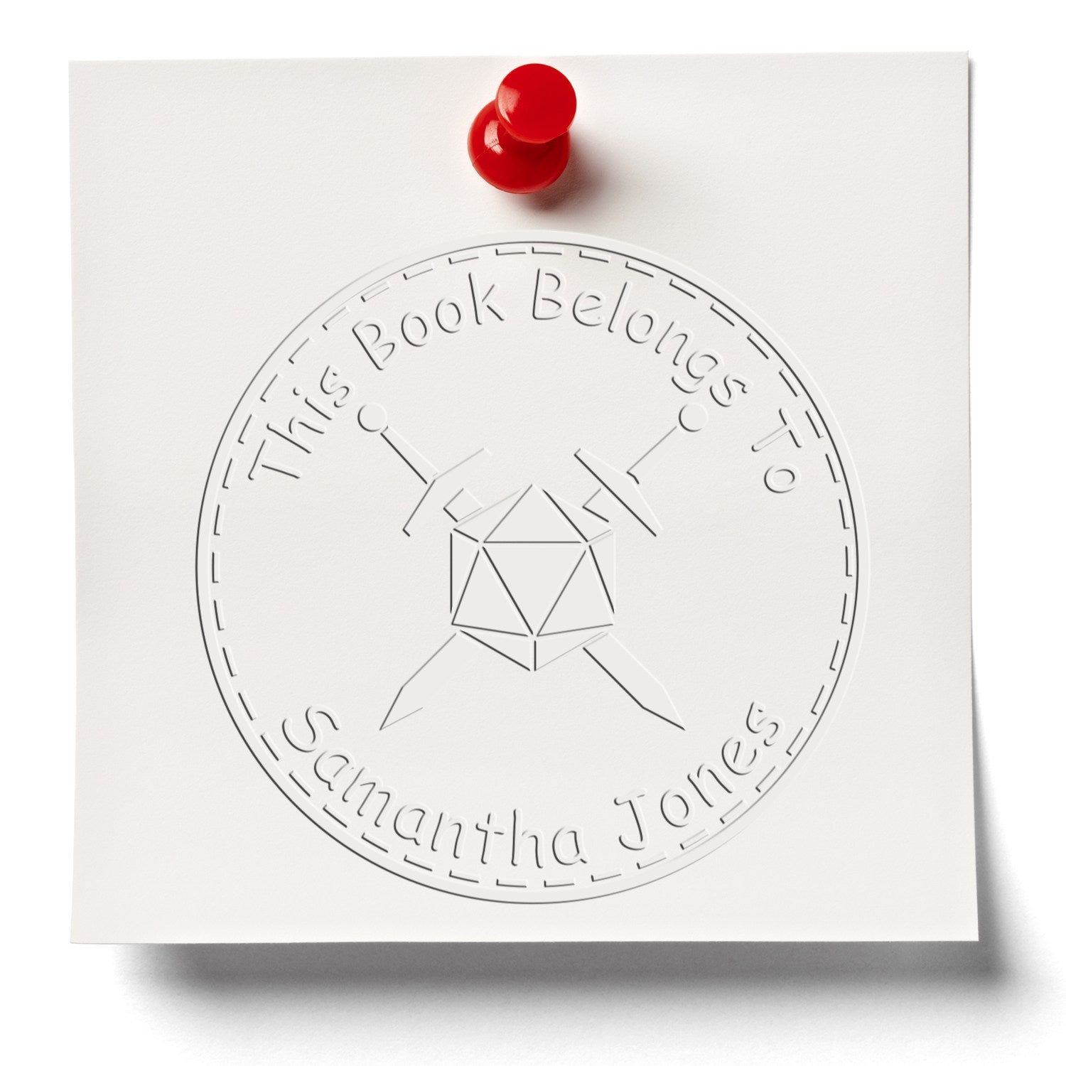 White embossed book-belongs-to seal stamp design with red tack, circular border, and geometric book icon.