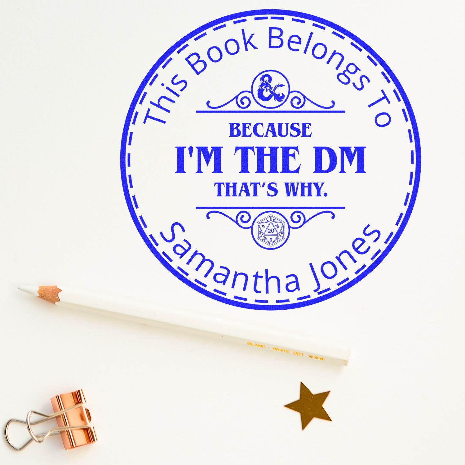 Blue custom stamp seal reading This Book Belongs to Samantha JonesBecause Im the DM on white paper.