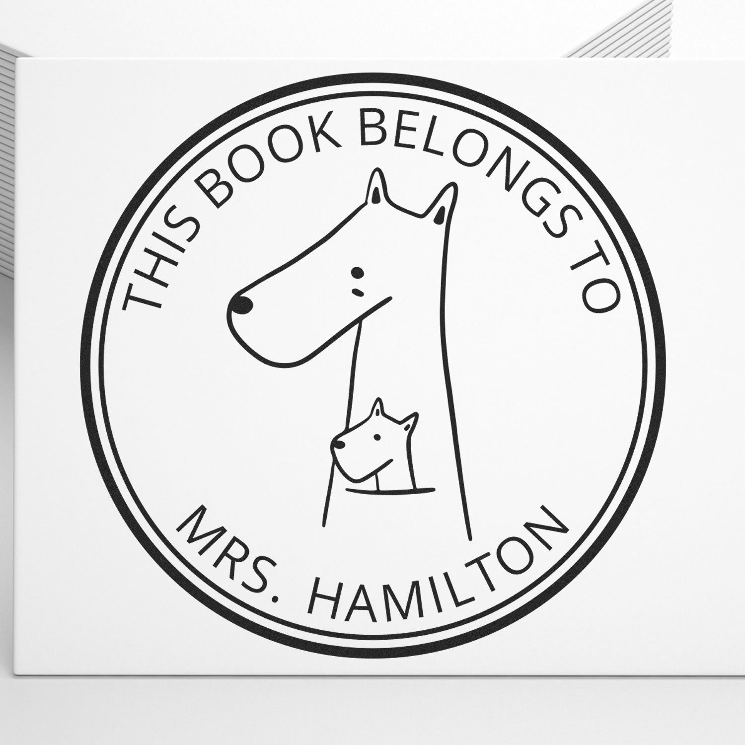 MuddleMoo Cartoon Animal Self-Inking Custom-Made Ex Libris Book Stamp featuring a simple line drawing of a dog and puppy, labeled "This Book Belongs to Mrs. Hamilton." Ideal as a Customized Home Stamp for personalizing books.