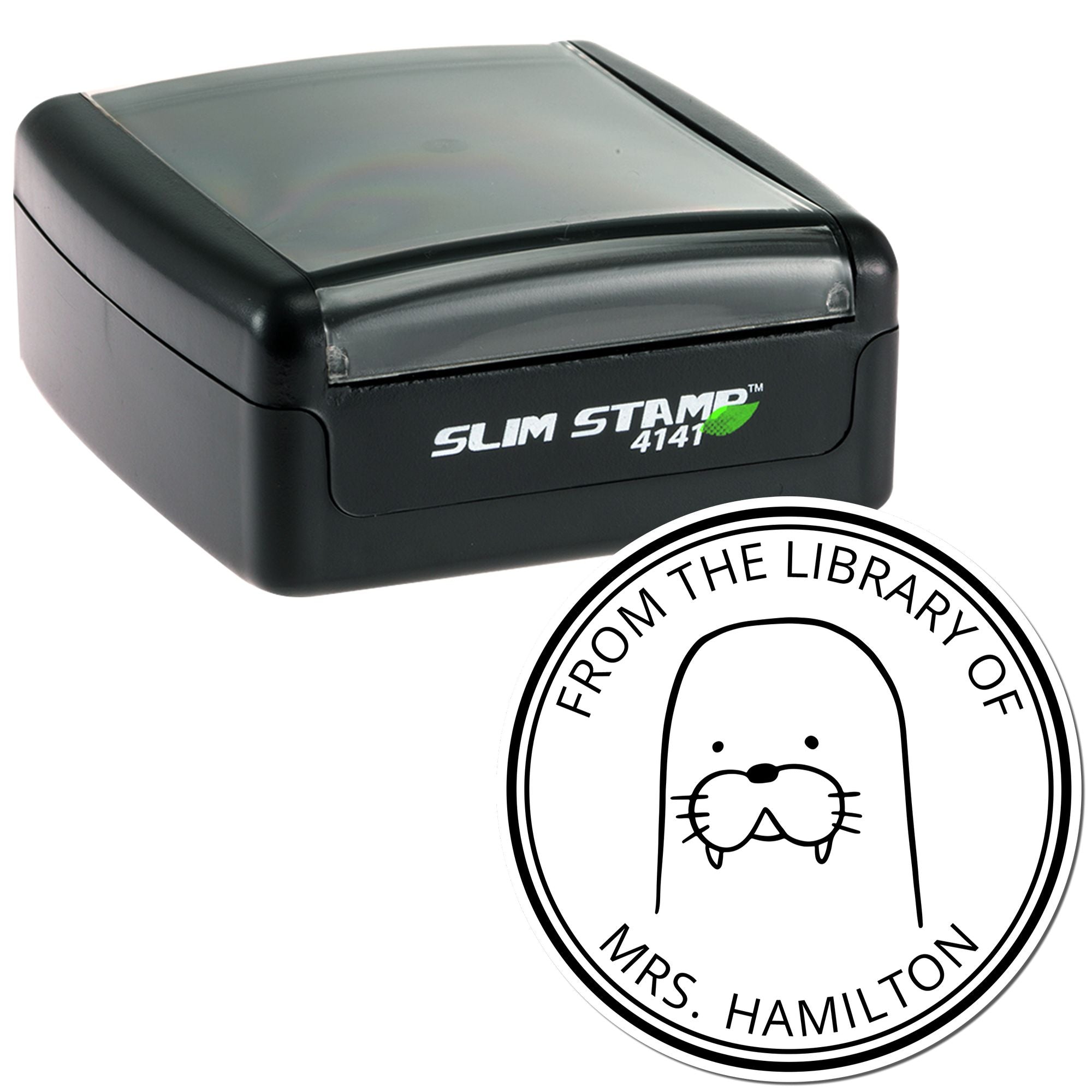 Image of a Slim Pre-Inked BumbleBristle Cartoon Animal Custom Name For Books Stamp featuring a walrus design with "From the Library of Mrs. Hamilton" text. Includes a Custom-Made Return Mail Stamper with a sleek black casing.