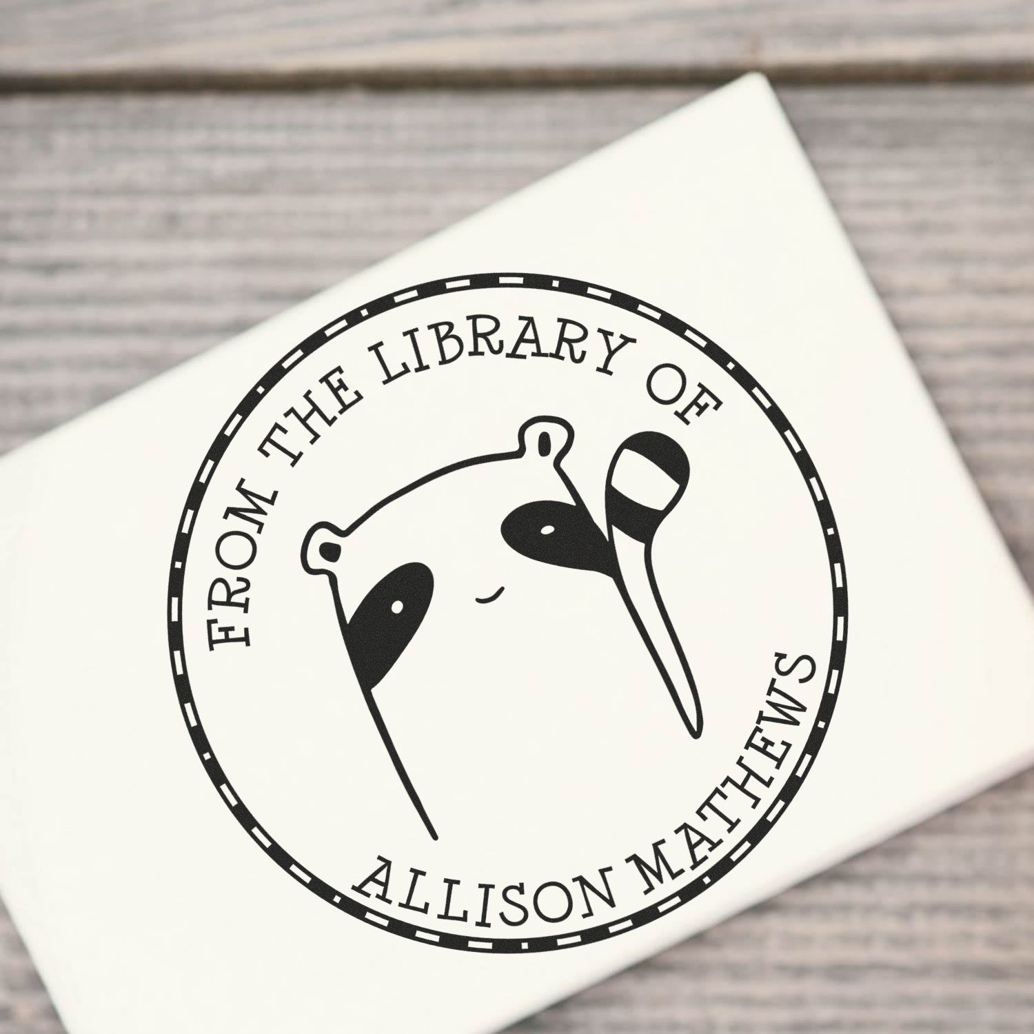 Cartoon animal stamp with "FreckleFlop" design, labeled "From the Library Of Allison Matthews." This pre-inked, customizable stamp is a custom-made mailing stamper, perfect for personalizing books or mail.