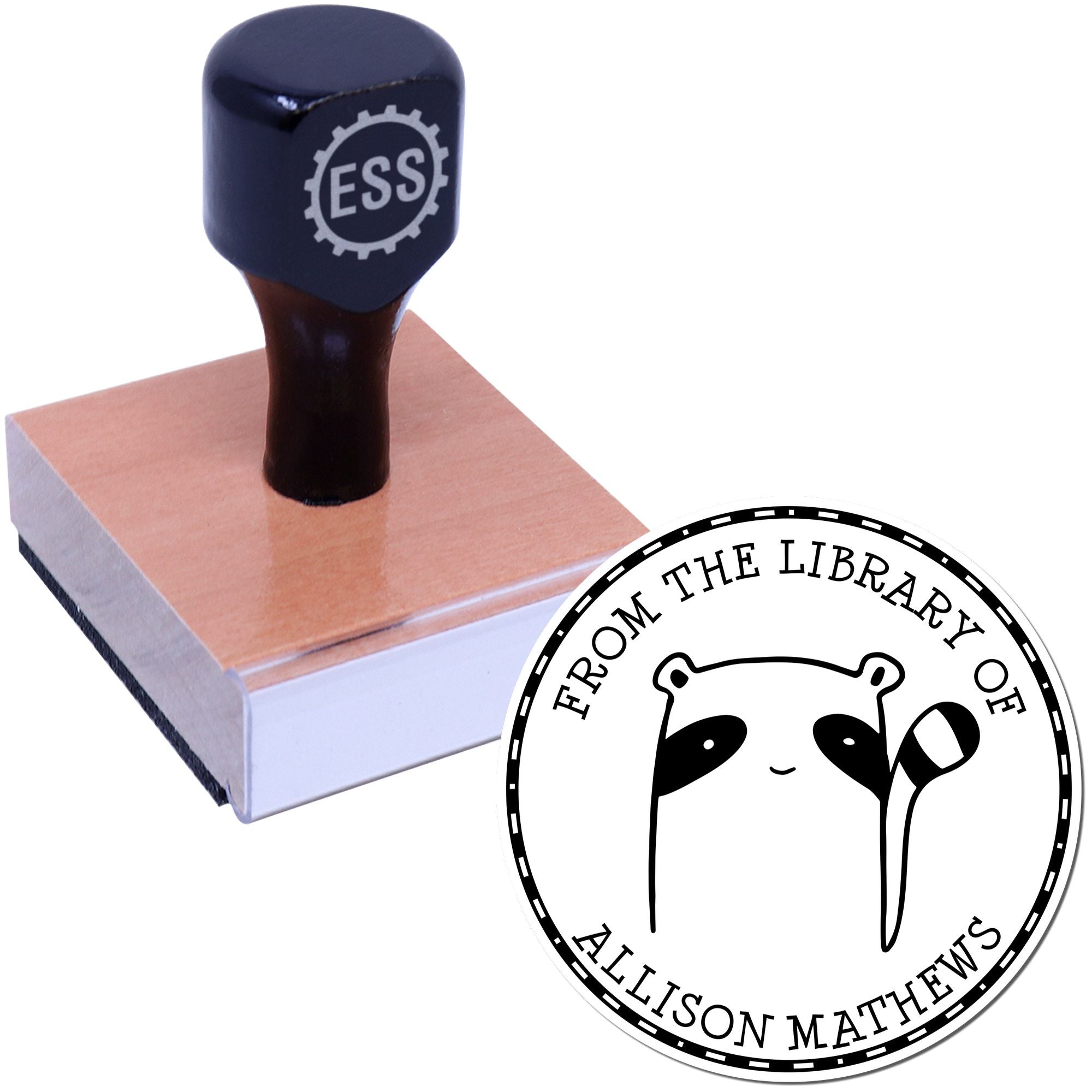 Wood handle stamp with "ESS" logo, featuring a FreckleFlop cartoon animal design. The stamp is part of a customized book collection, labeled "From the Library of Allison Matthews." It serves as a personalizable address stamp.