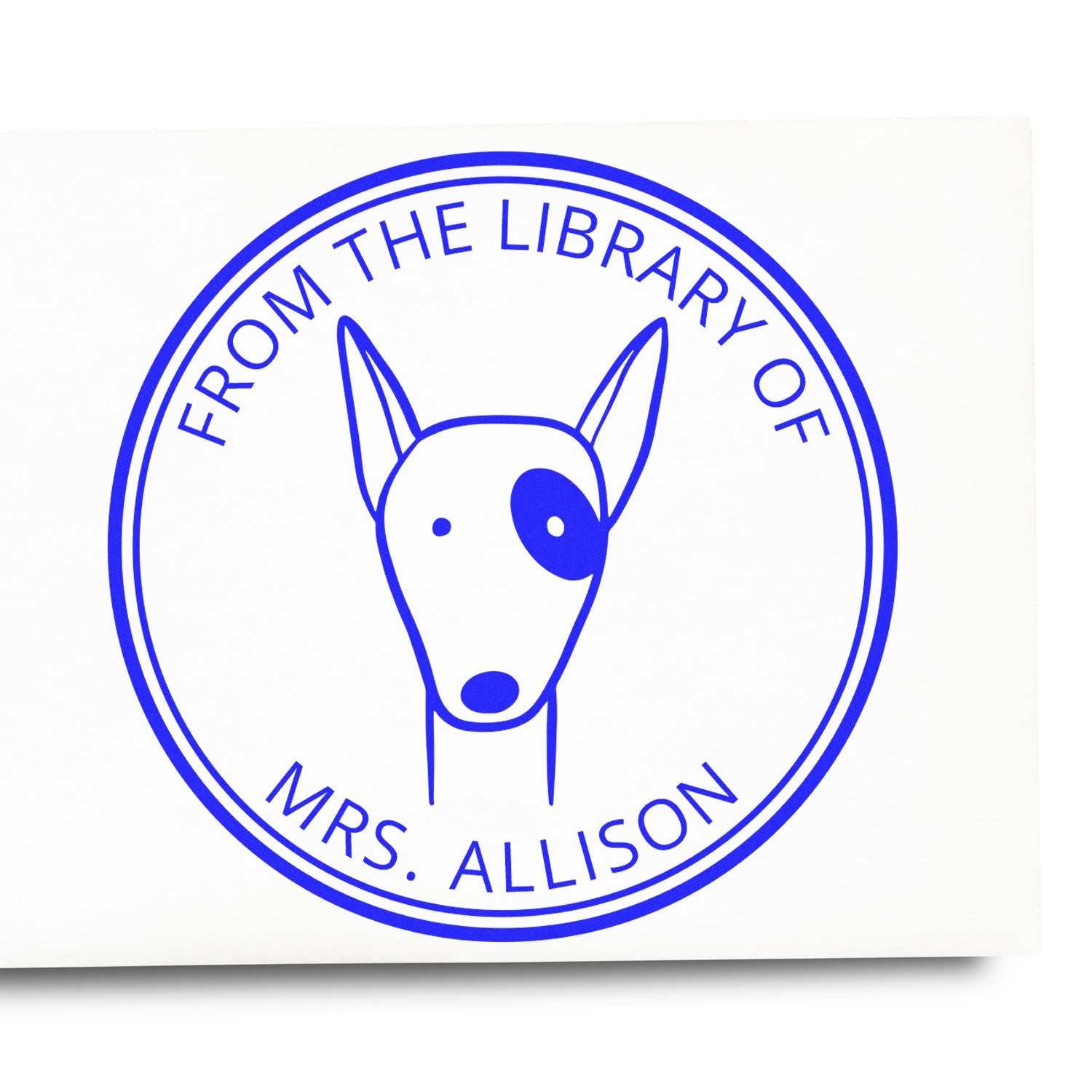 Image of a custom-made home stamp featuring a cartoon animal with a wood handle. The stamp displays a RuffleRump design with the text "From the Library of Mrs. Allison." It's a personalized book signature stamp.
