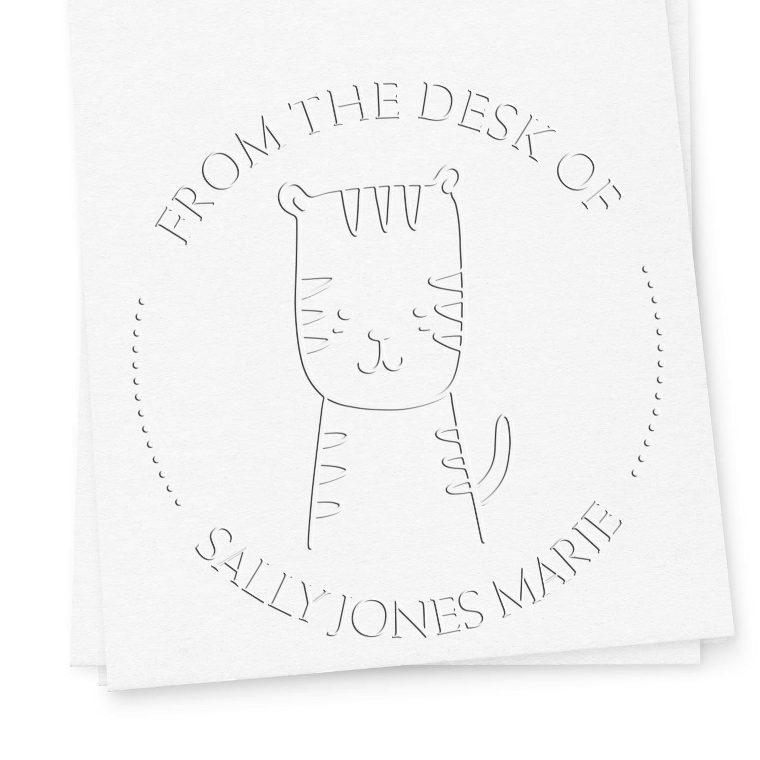 TizzyTumble cartoon animal embossing seal with a cute design is shown on a white paper. The seal reads "From the Desk of Sally Jones Marie." Nearby, a customized address stamp is visible, highlighting personalized book design elements.