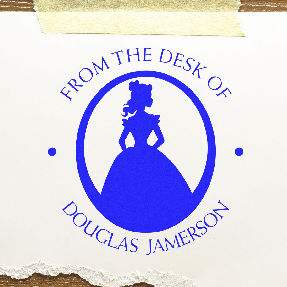 Blue custom stamp seal with silhouette of a girl in a dress and text From the Desk of Douglas Jamerson on white paper
