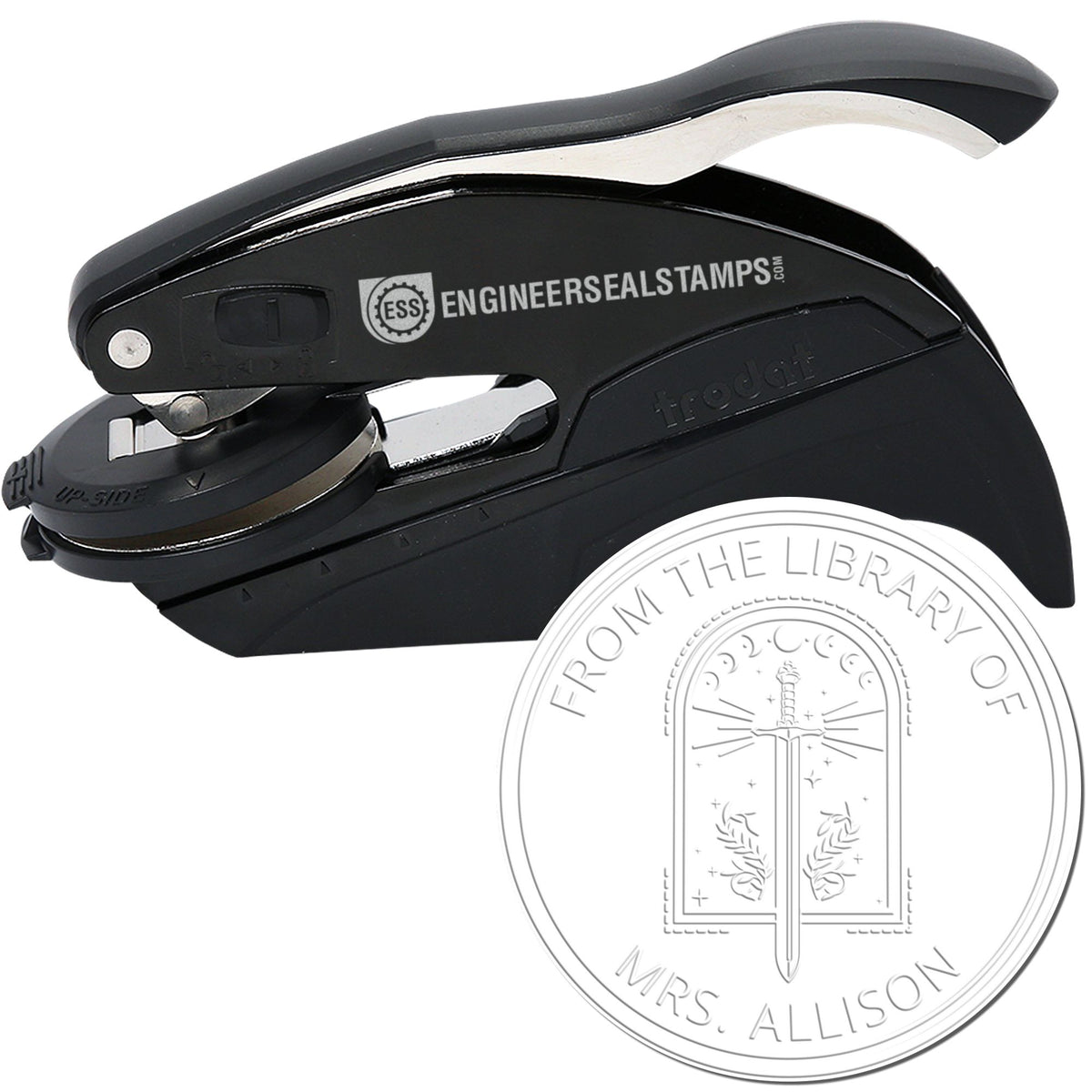 Black handheld embosser stamp and seal with silver trim, showing a round library seal impression