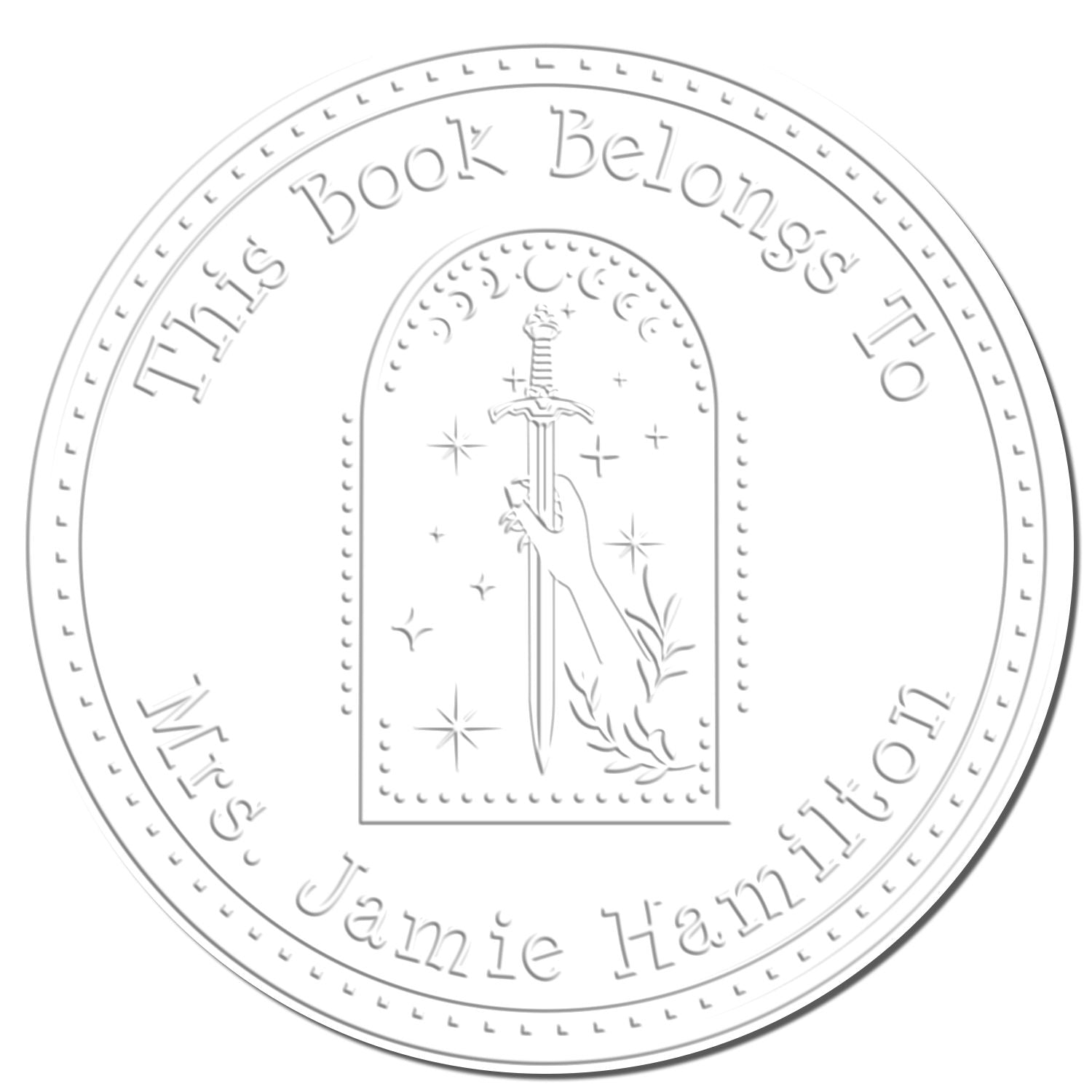 White circular book stamp seal with embossed text, a hand holding a sword, and sparkles in an arched frame.