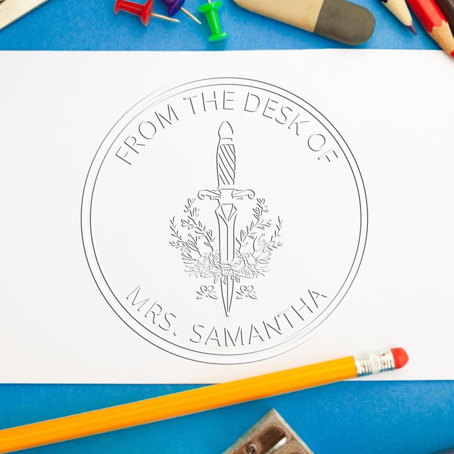 Trodat Voidwalker Mythical Swords hybrid fantasy stamp in use, featuring a customized home library seal with intricate sword designs.