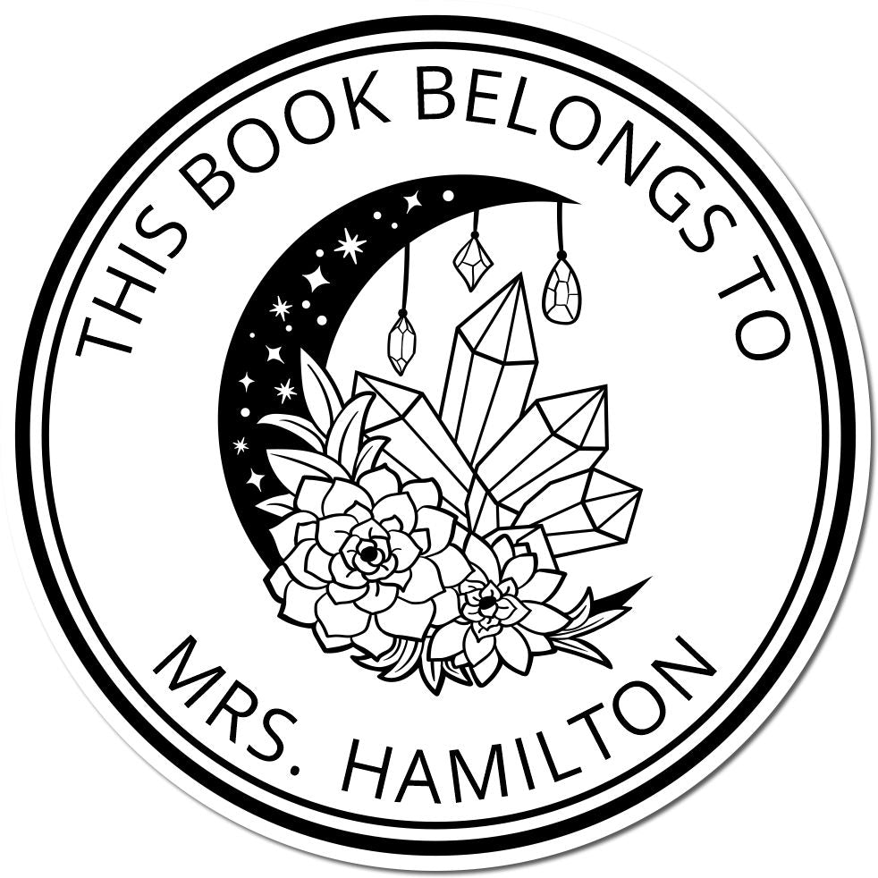 Round black-and-white book stamp seal with crystals, hanging gems, and floral bouquet; reads This Book Belongs to Mrs. Hamilton.