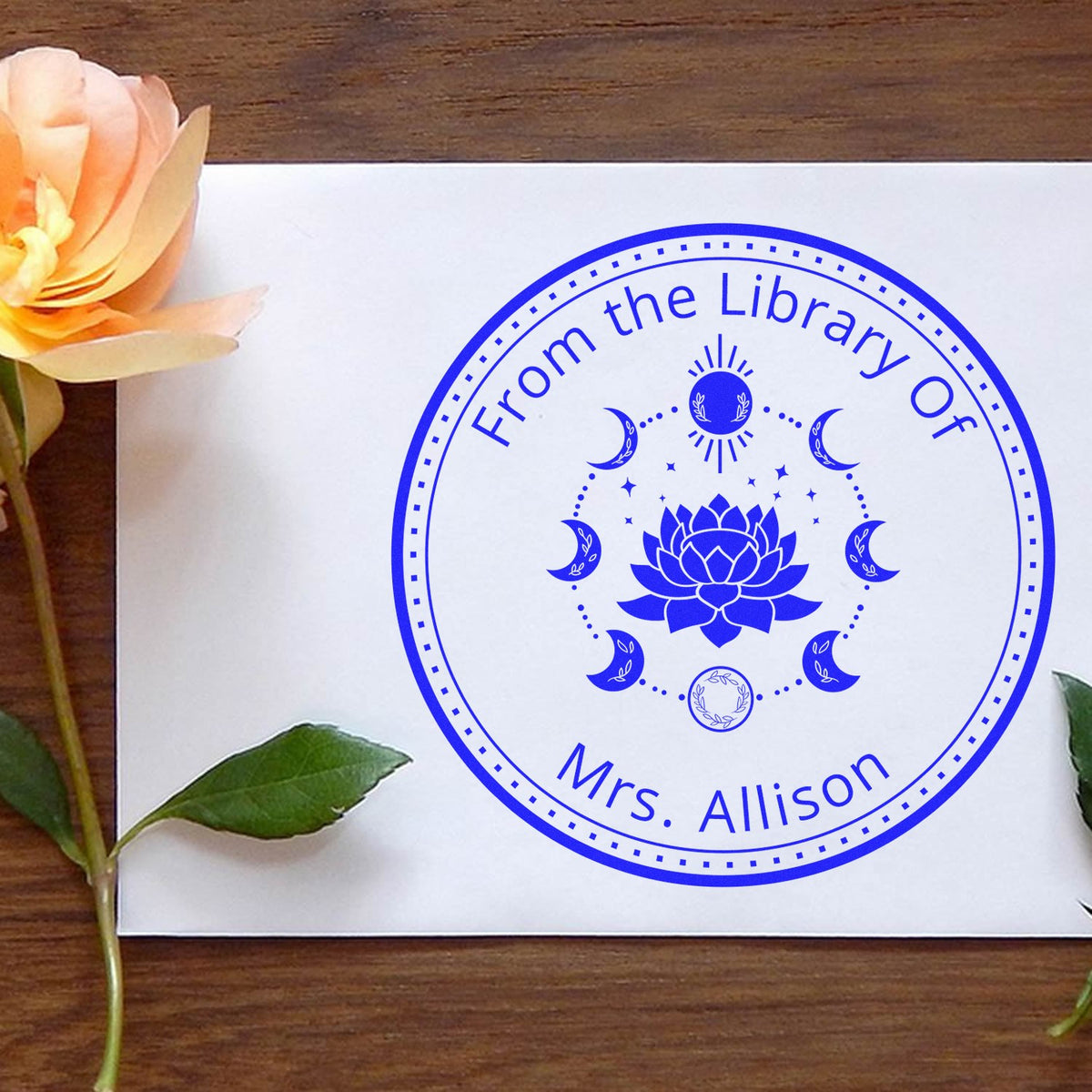 Trodat Slim Pre-Inked Nyx's Silhouette Mystic Astrological Ex Libris Stamp in use, featuring celestial design for personalized bookplates.