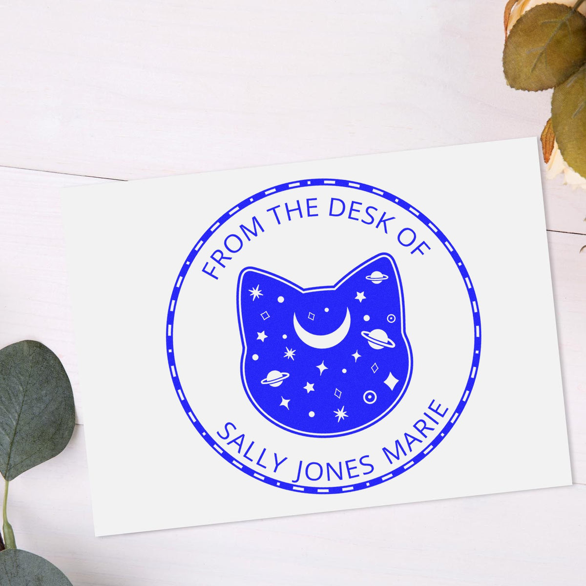 Blue custom stamp seal with cat, crescent moon and stars, reading From the Desk of Sally Jones Marie.
