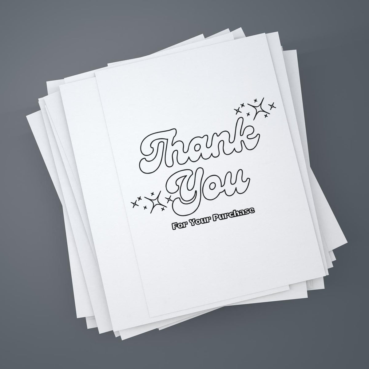 Stack of white thank-you stamp/seal cards with black outlined lettering and sparkles on a gray background