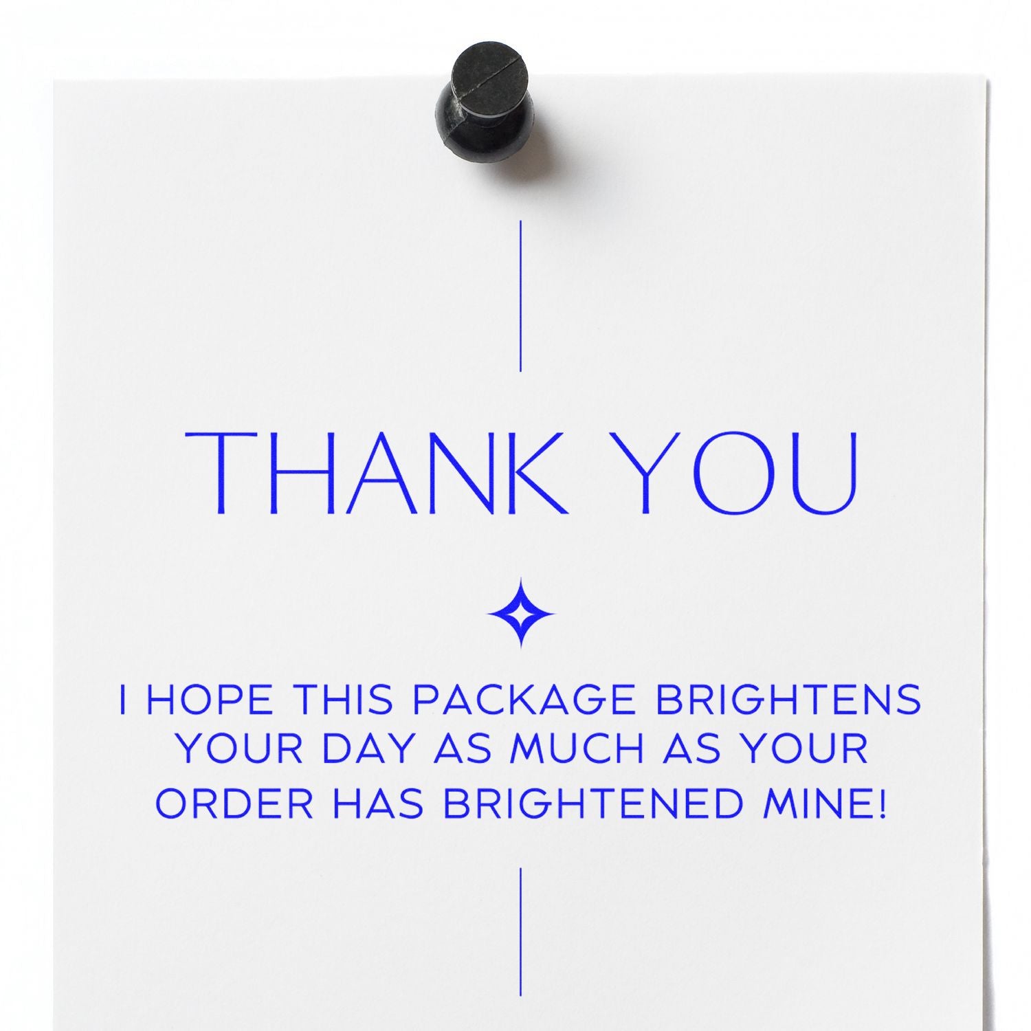 White thank-you insert with blue lettering and a black stamp seal topper.