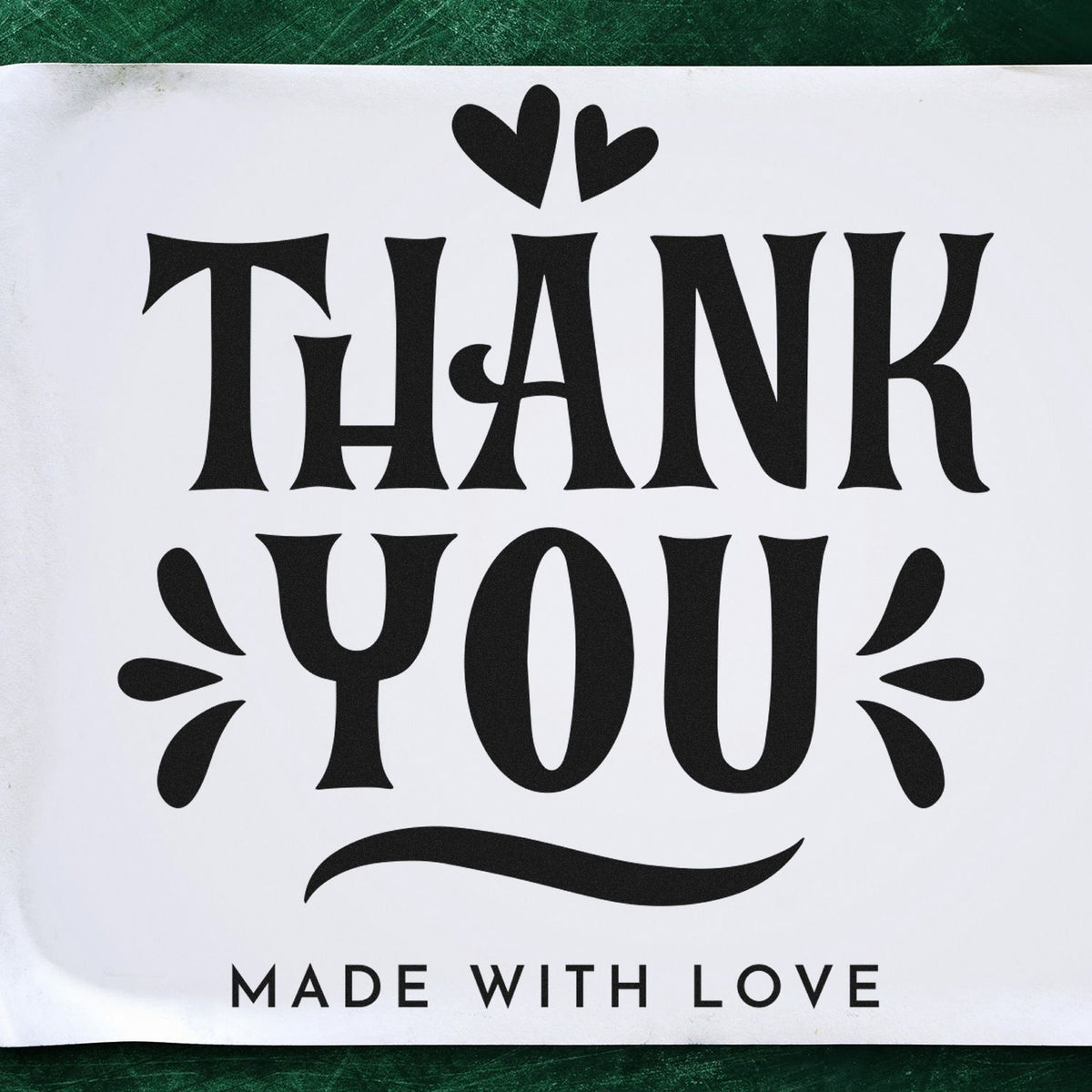 Black decorative thank you stamp/seal with hearts and Made with Love on a white background