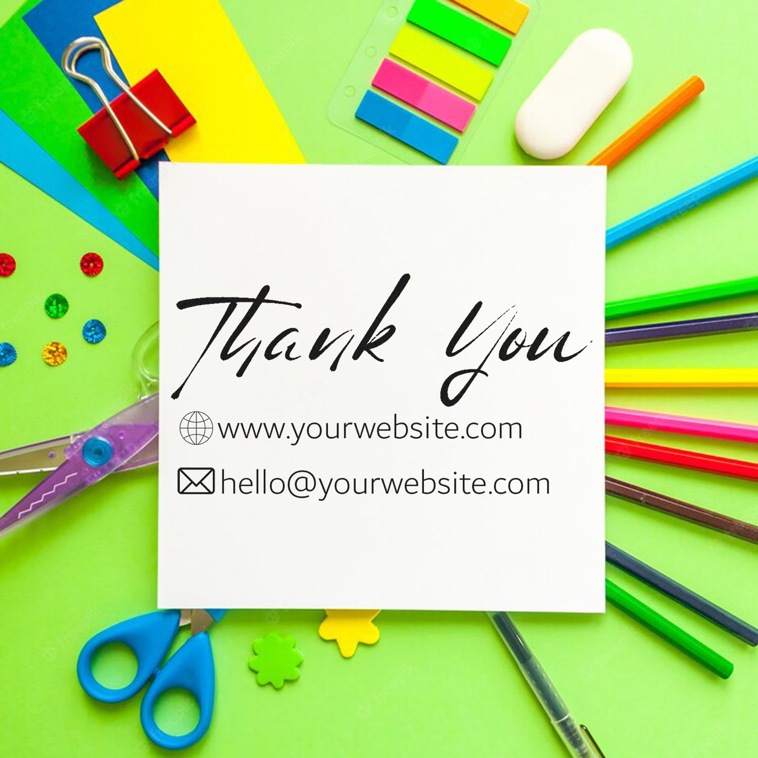 Custom stamp and seal thank-you card on bright green background with colorful stationery, binder clip, and scissors.