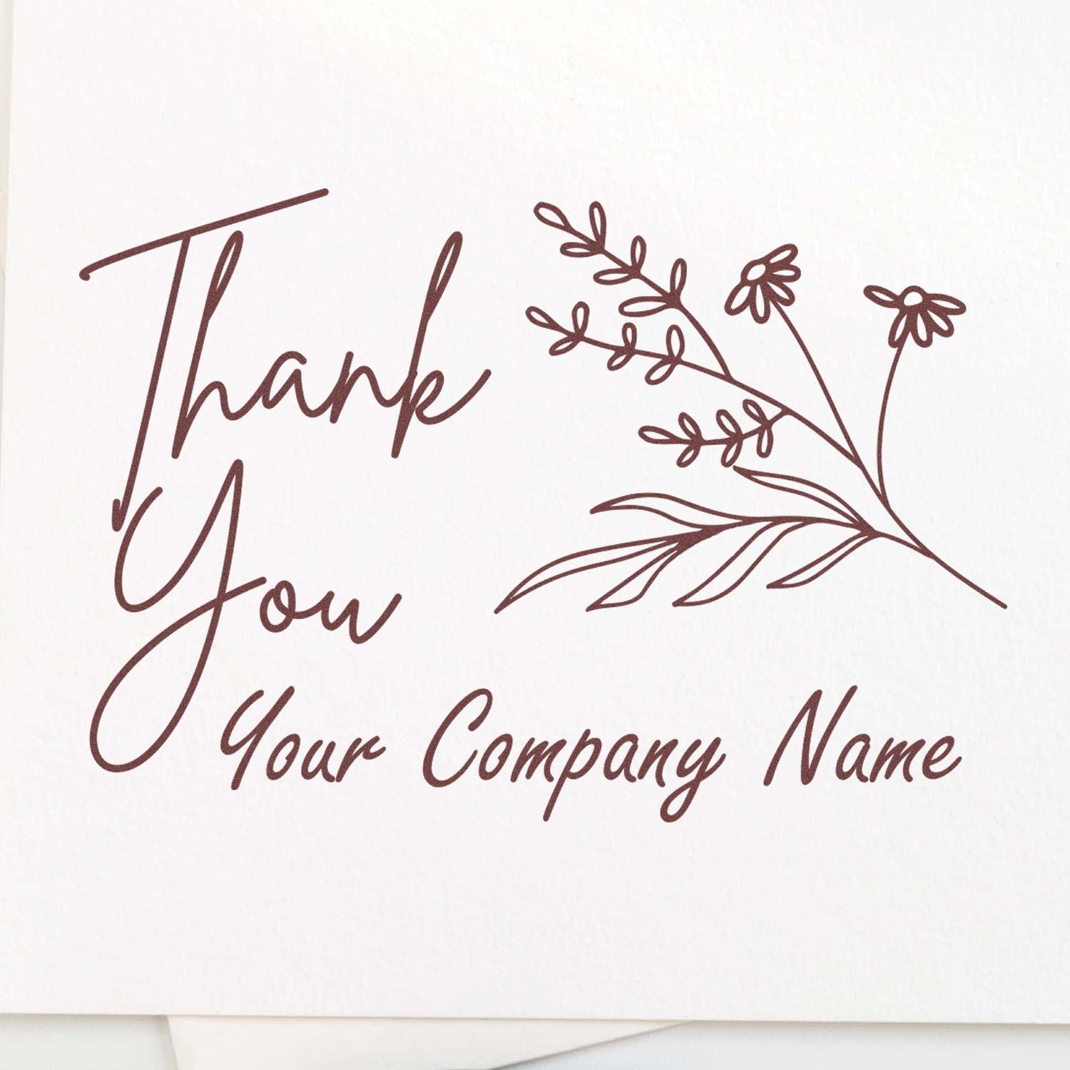 Brown custom thank-you stamp seal with floral branch and company name on a white background.