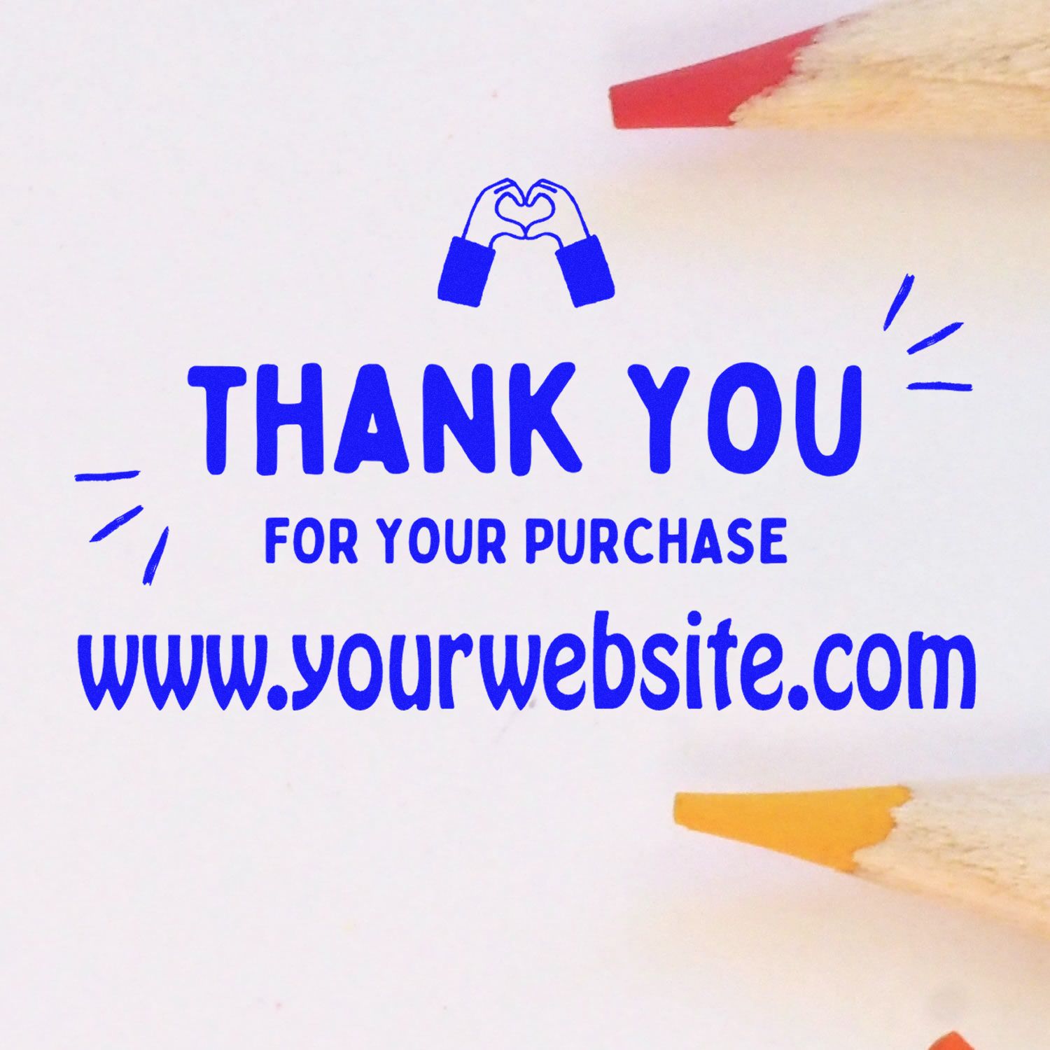 Blue thank-you stamp seal with heart hands icon, For Your Purchase, and website on white paper with colored pencil tips.