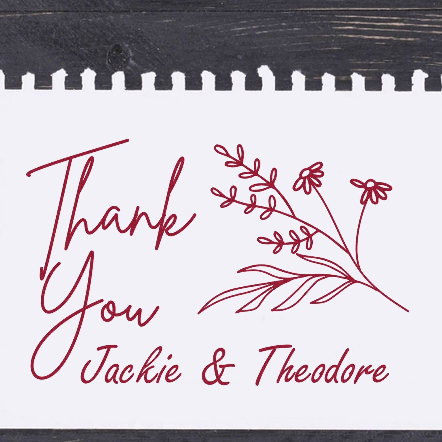 Burgundy custom thank-you stamp and floral seal with Jackie & Theodore on a white card with black top edge.
