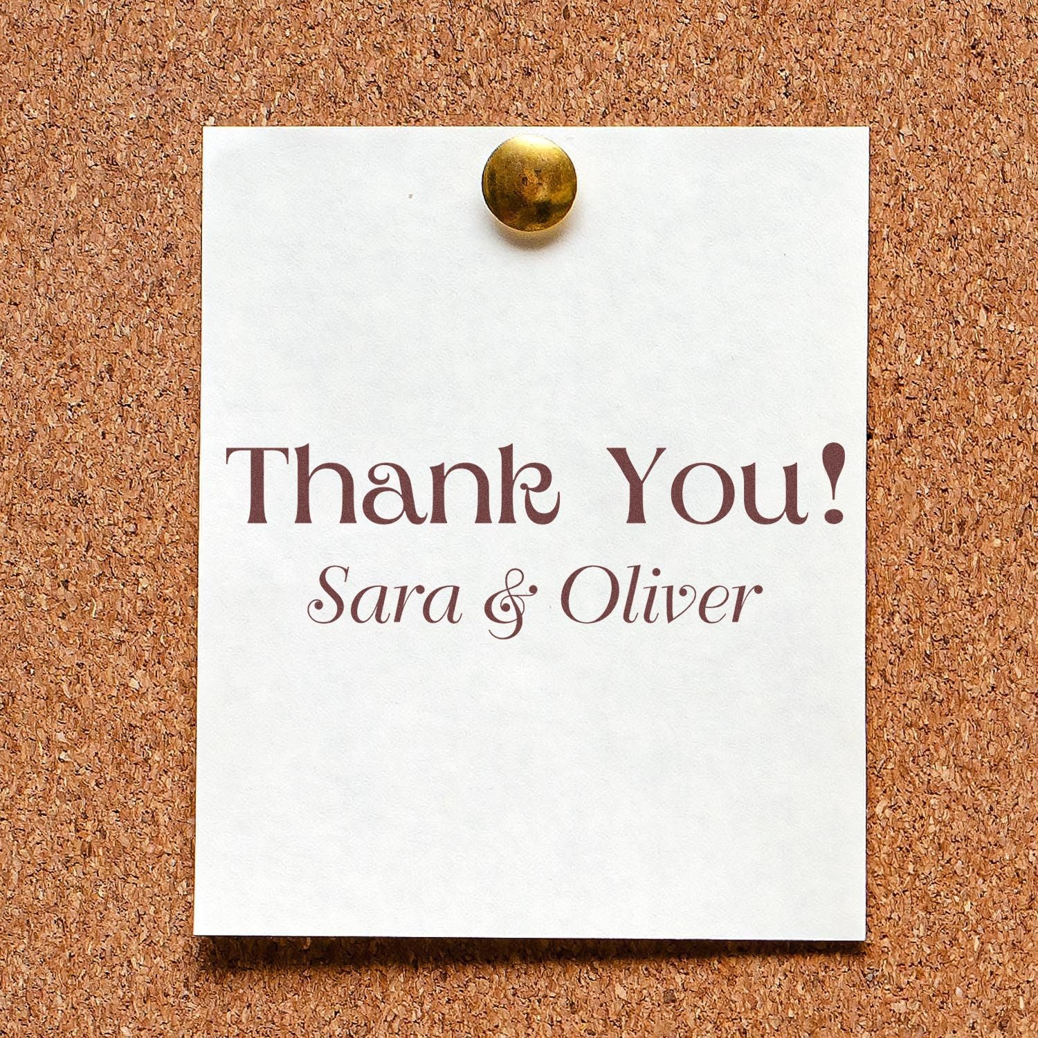 White thank-you card with maroon lettering, gold brad, and custom stamp-and-seal style names Sara & Oliver on corkboard.
