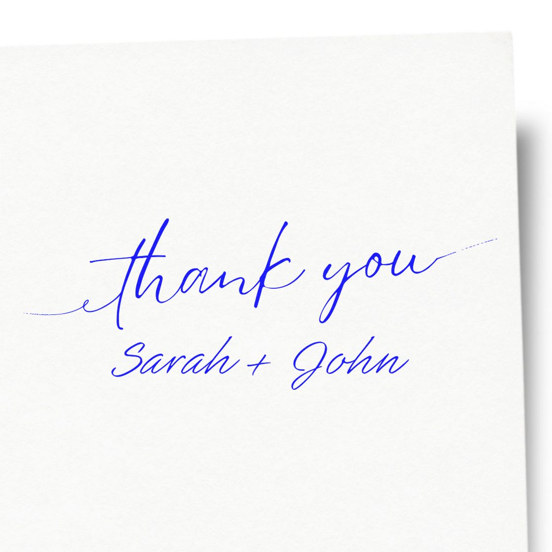 Blue thank you stamp seal with Sarah + John in cursive on a white card