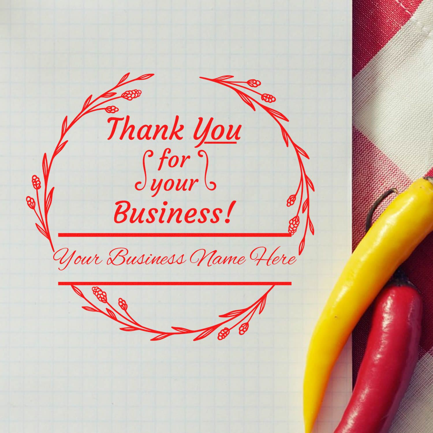 Red decorative thank-you business stamp seal on grid paper with wreath border; yellow and red handles visible at right.