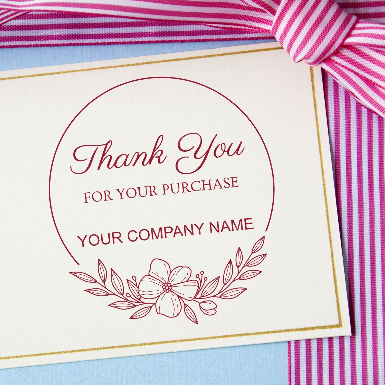 Custom burgundy thank-you stamp and seal on cream card with gold border, floral accent, and pink striped ribbon.