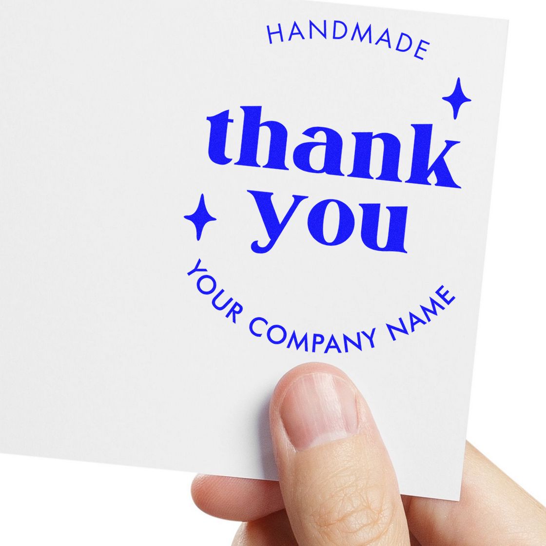 Blue handmade thank you stamp seal with stars and Your Company Name on white card held by hand.