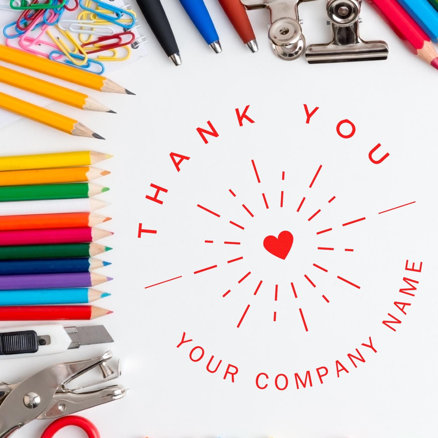 Custom red thank-you stamp seal with heart, surrounded by colorful pencils, pens, clips, and tools on white.
