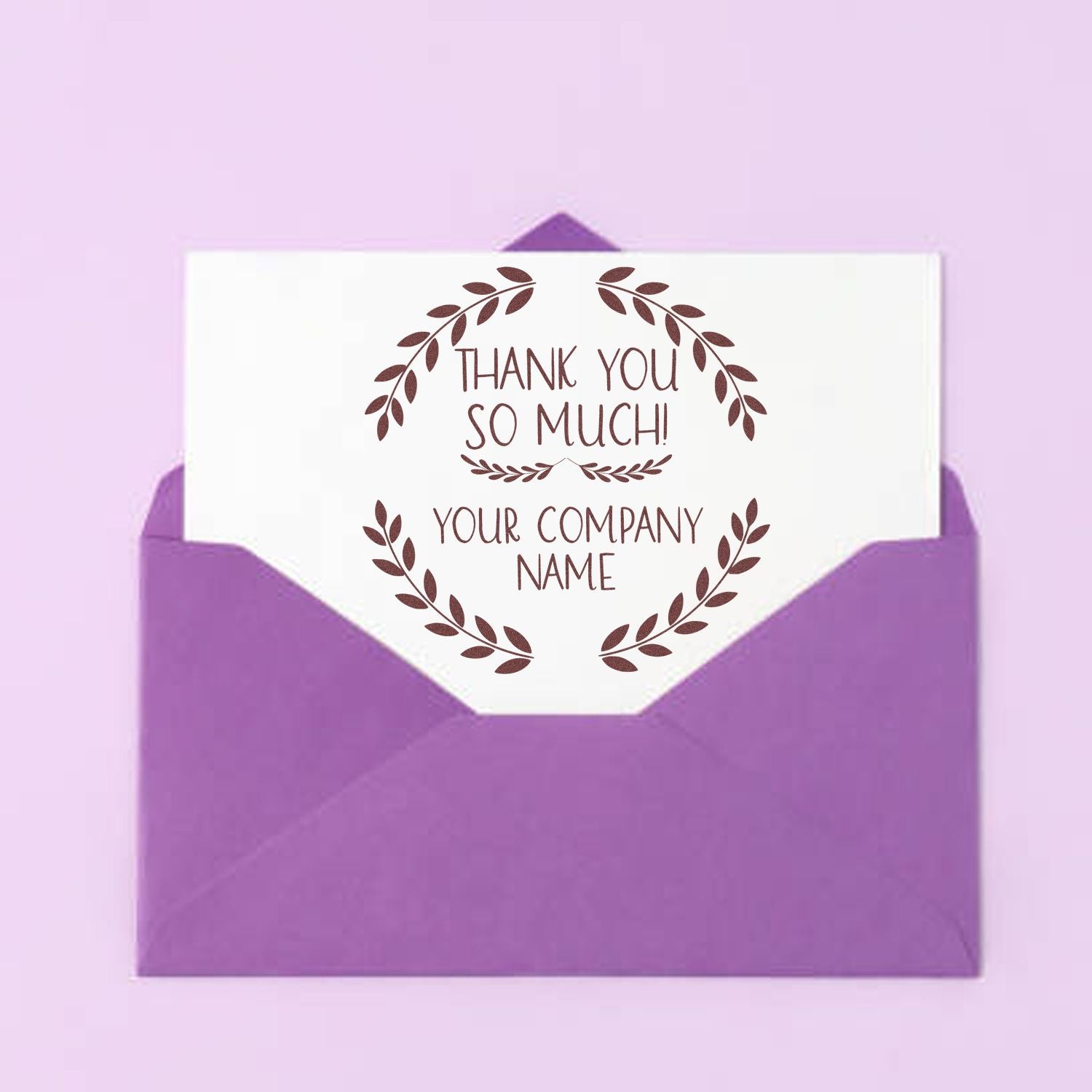 Purple envelope with white thank-you card featuring brown leaf wreath custom stamp and seal design with company name.