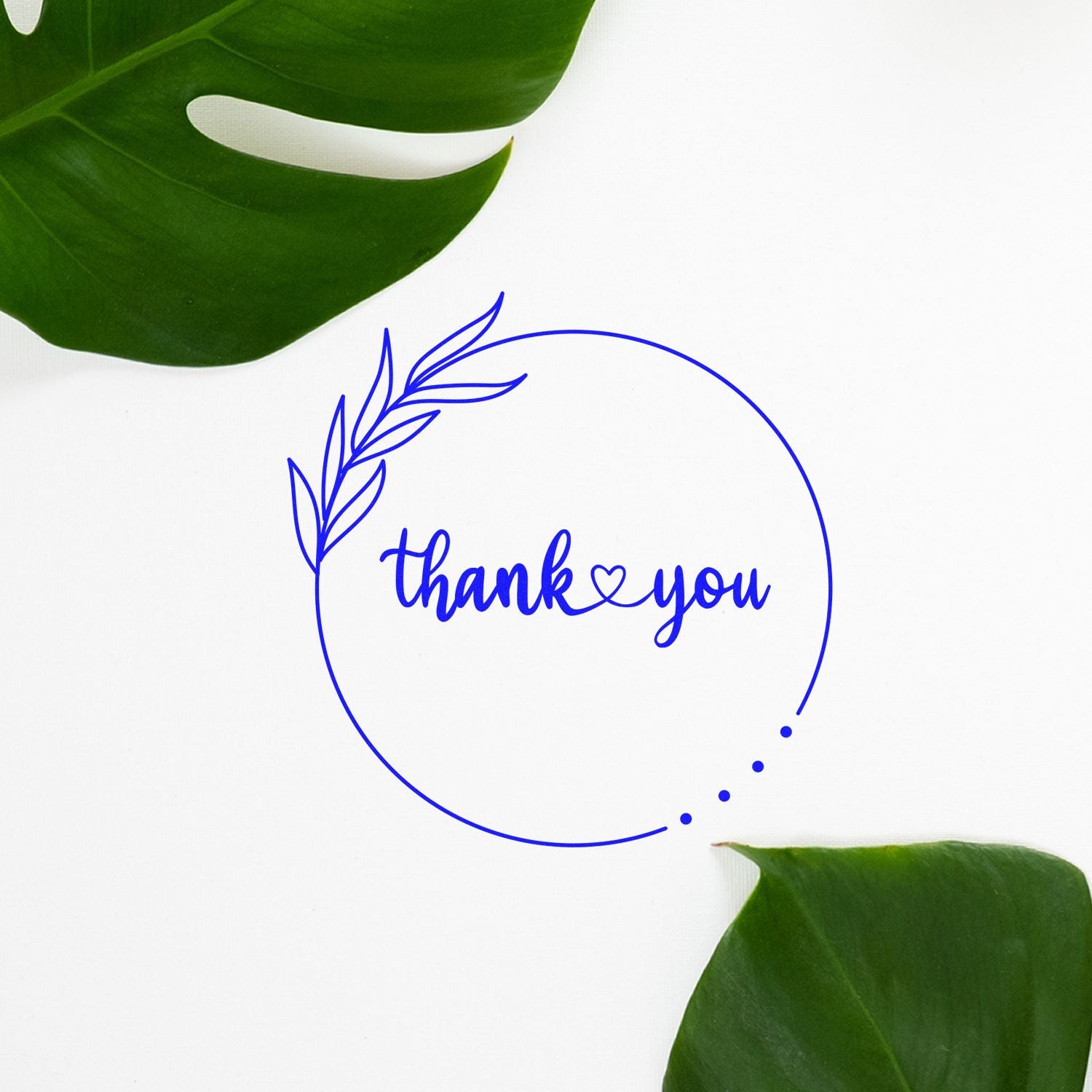 Blue thank you stamp seal with leaf wreath, on white background, framed by green tropical leaves.