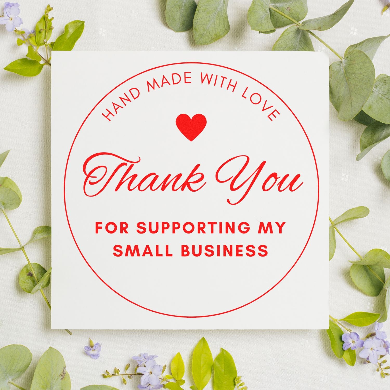Red circular thank-you stamp seal on white card, with heart and hand made with love for supporting my small business.