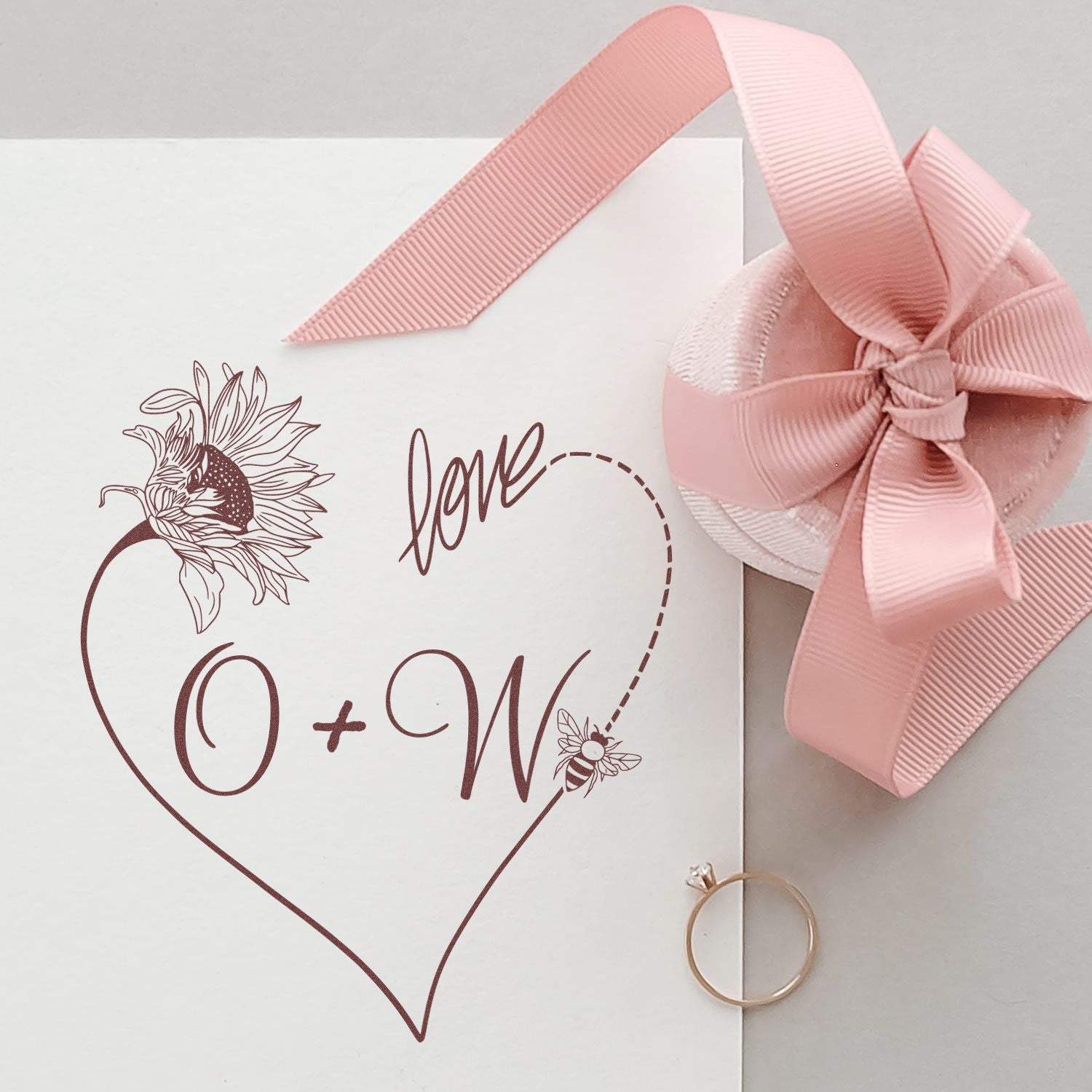 Custom wedding stamp and seal on white card, burgundy heart with sunflower, bee, love script, and pink ribbon bow.