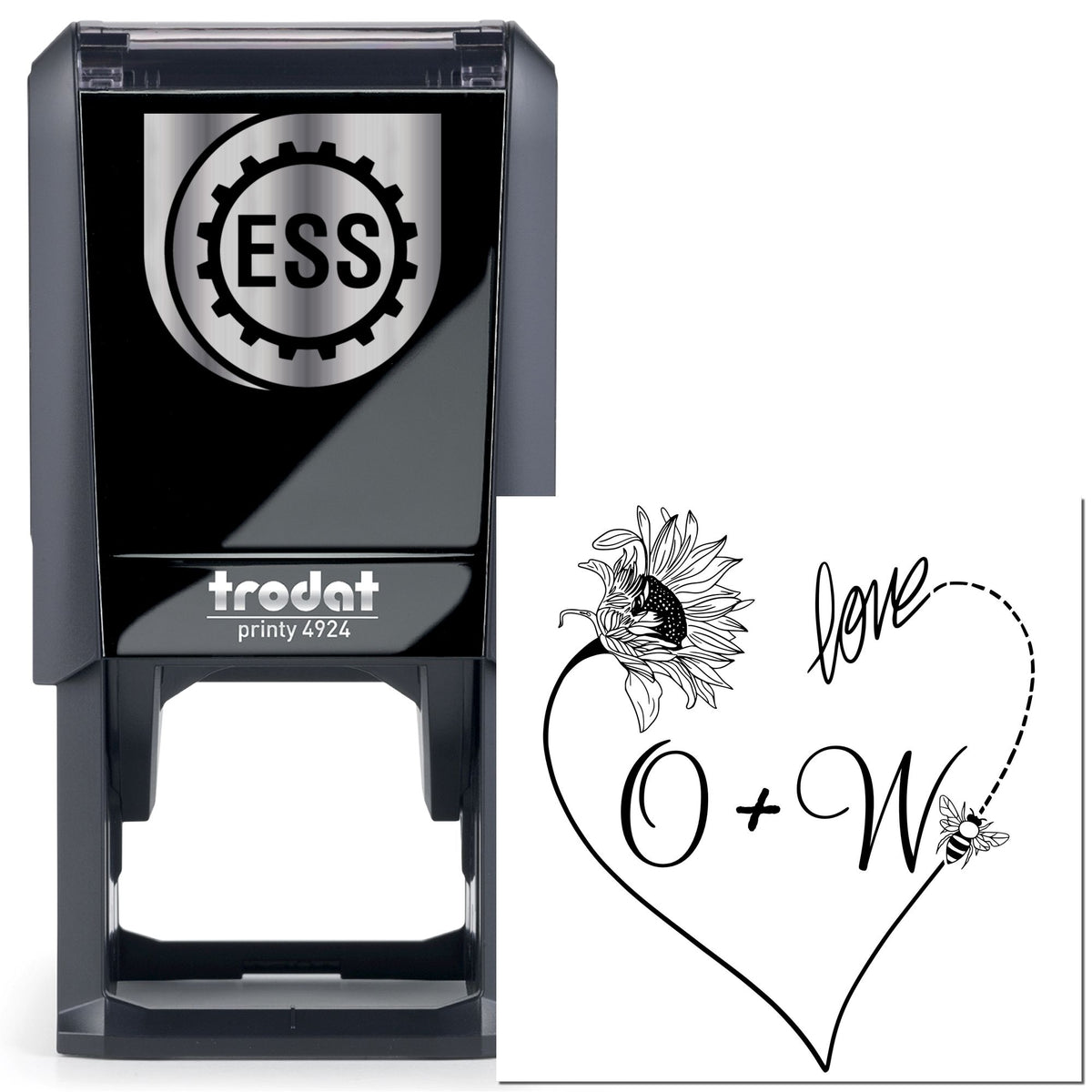 Black Trodat self-inking stamp with silver ESS seal and white sample imprint featuring heart, flower, love and O+W initials