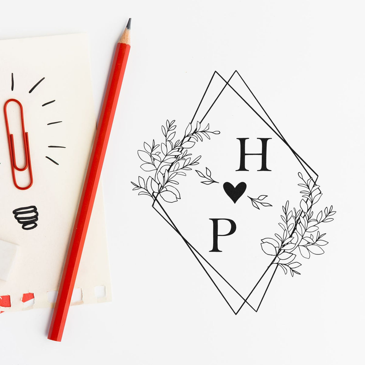 Square Heartfelt Harmony Couple's Monogram Stamp by ESS in use for wedding invitations or stationery.