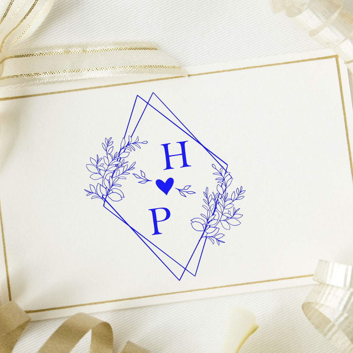 Square Heartfelt Harmony Couple's Monogram Stamp from ESS in use, showcasing elegant wedding monogram design for stationery.