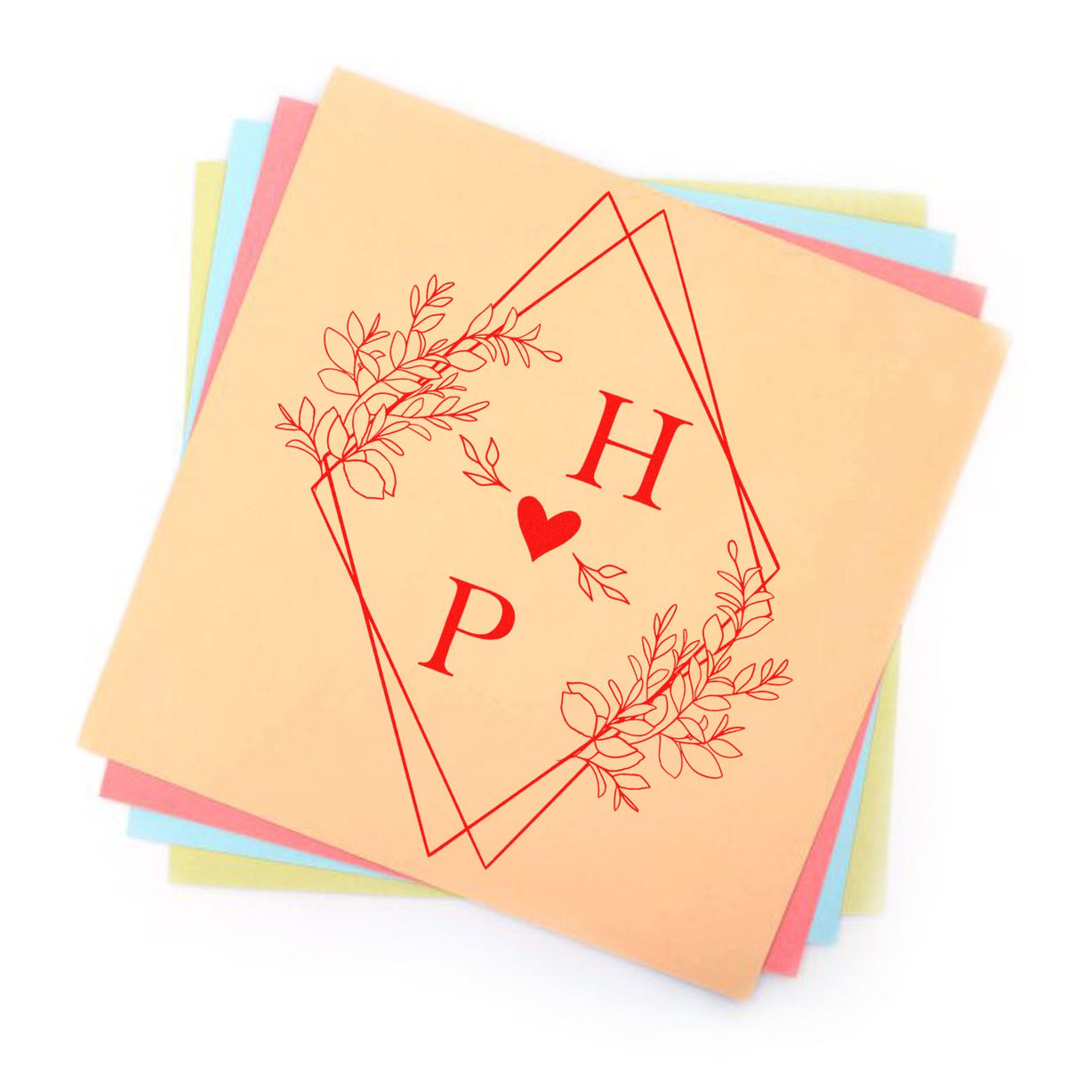 Square Heartfelt Harmony Couple's Monogram Stamp by ESS in use, showcasing elegant wedding-themed monogram design.
