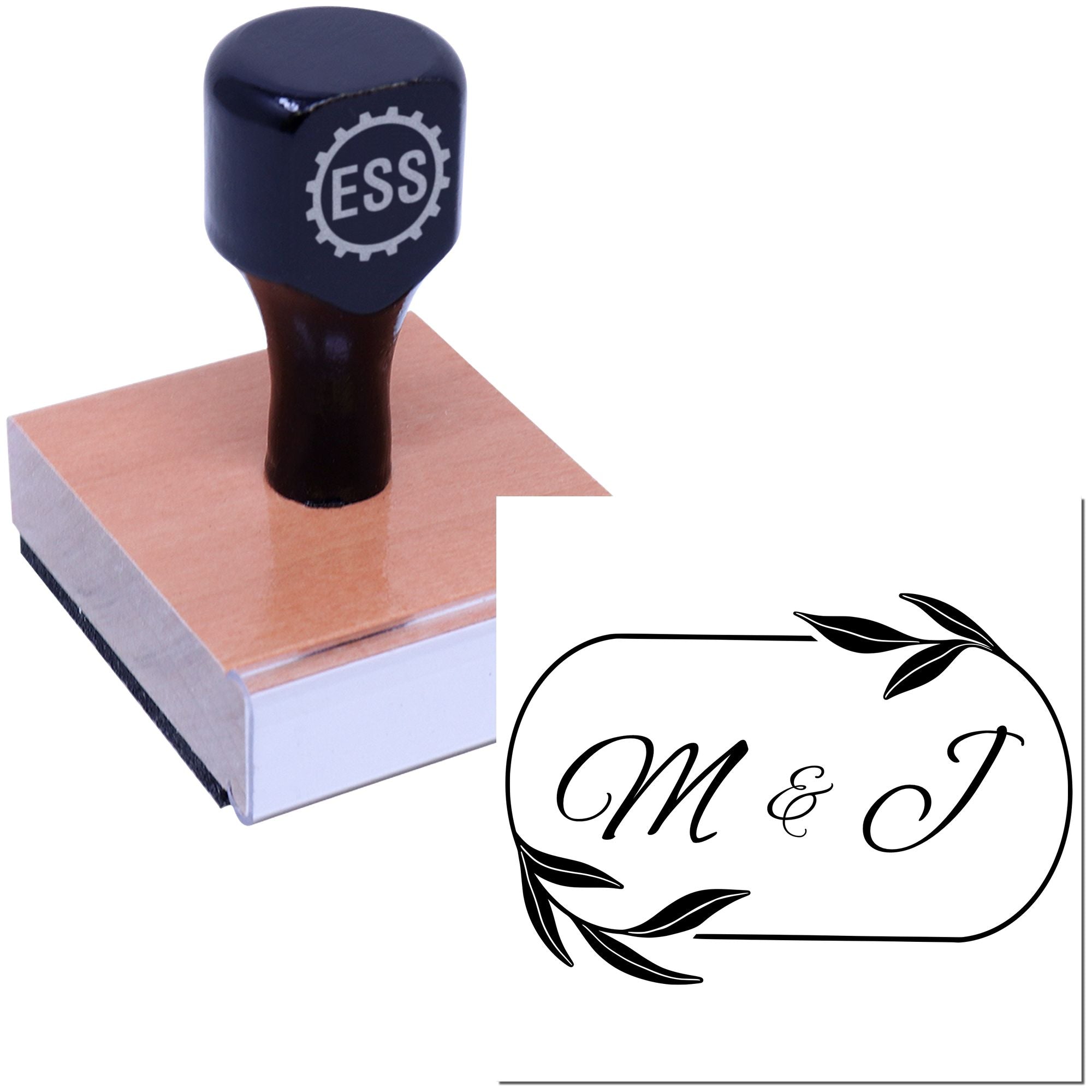Black custom stamp on a wooden block with copper top, showing an elegant black M & J monogram seal.