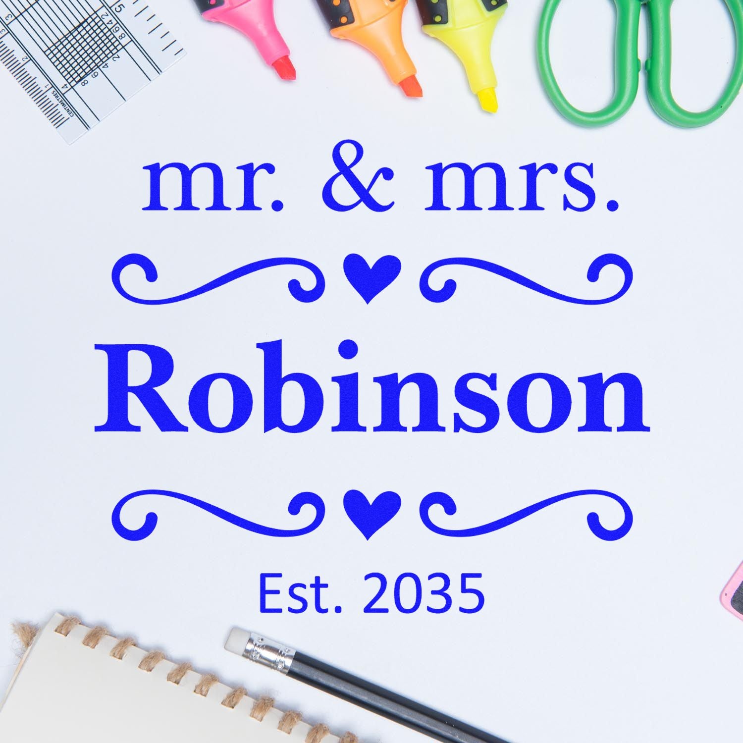 Custom blue Mr. & Mrs. Robinson stamp and seal design with hearts, flourishes, and Est. 2035 on white background