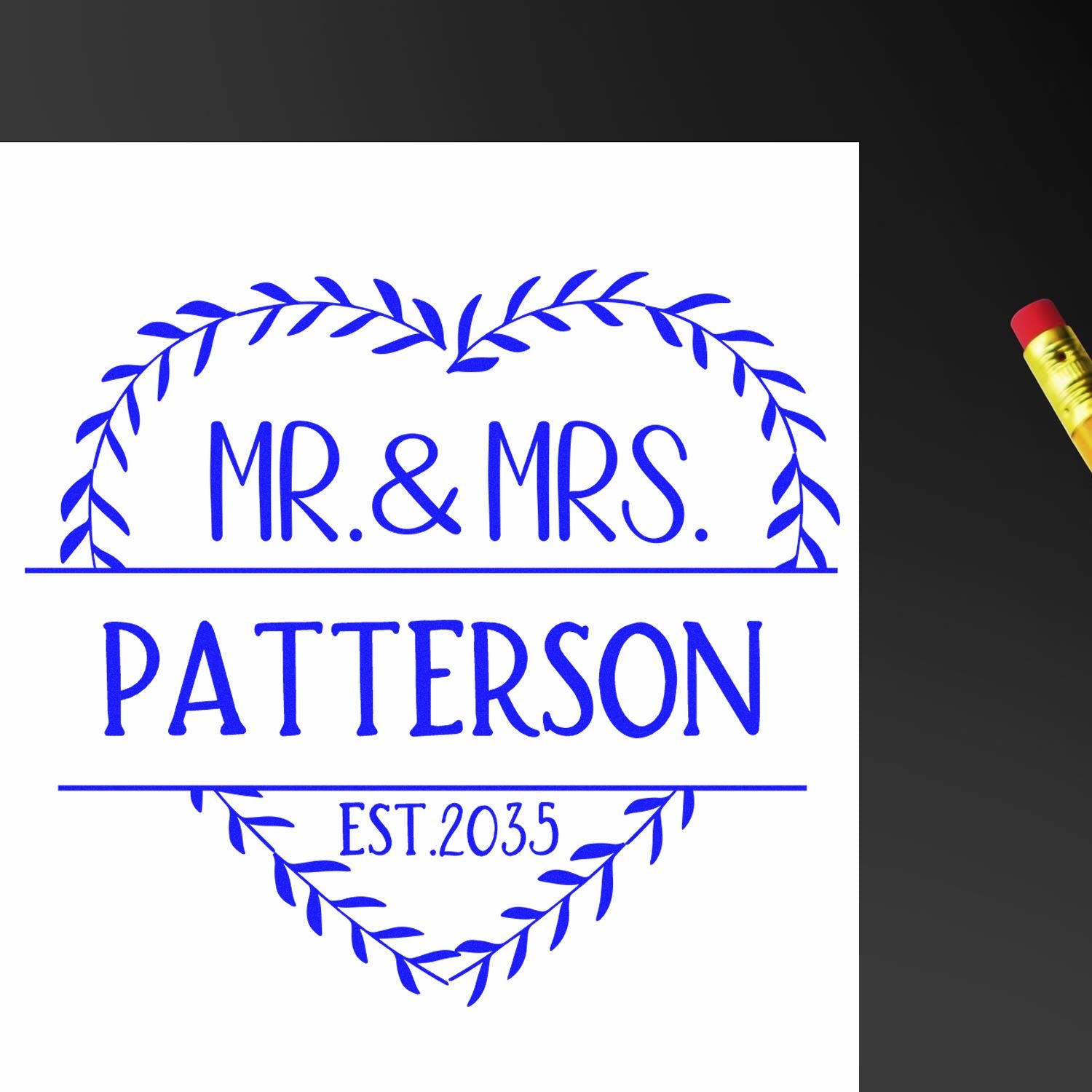 Blue decorative wedding stamp seal with laurel wreath reading MR. & MRS. PATTERSON and EST. 2035 on white paper.