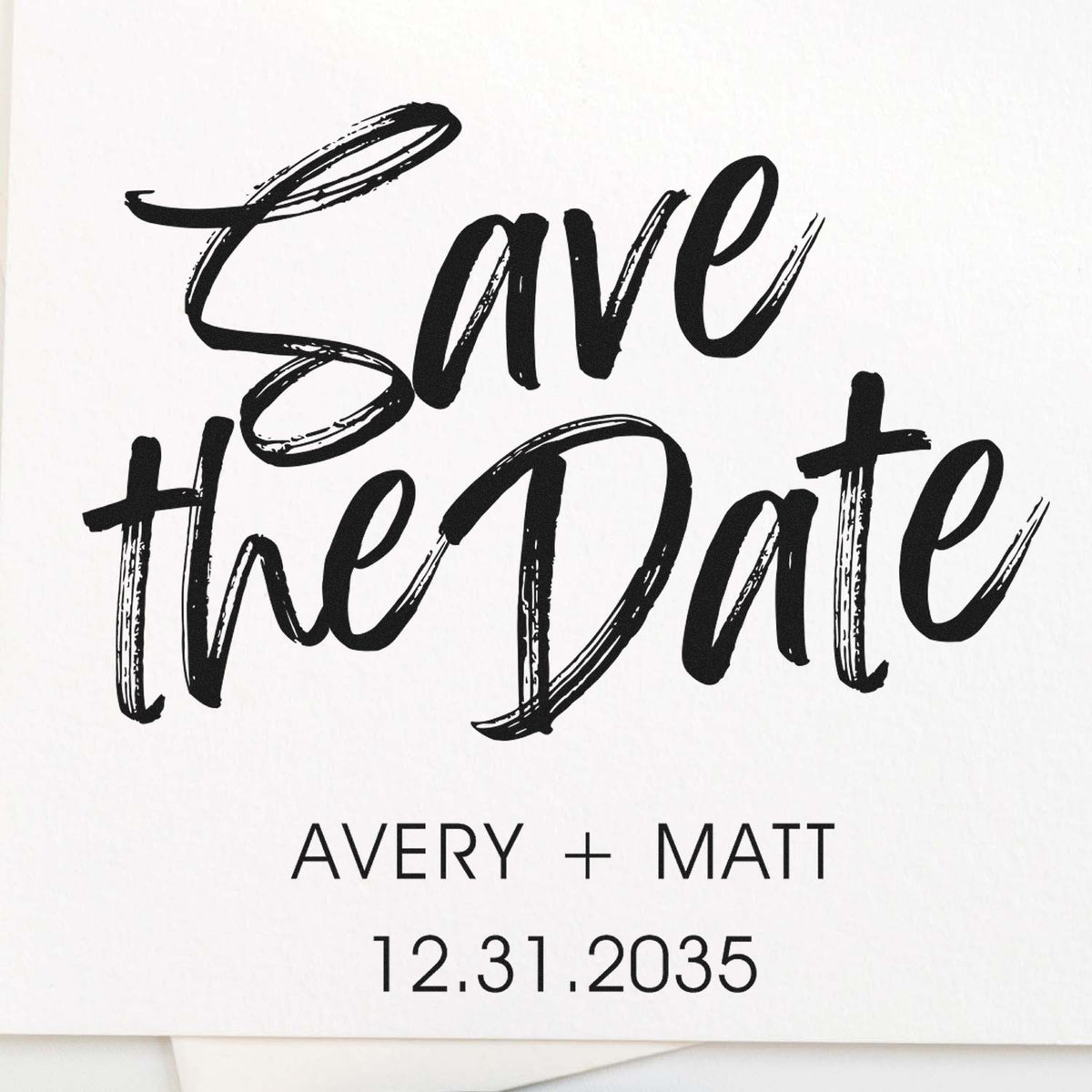 Black brush-script Save the Date custom stamp and seal design, with Avery + Matt and 12.31.2035 on a white background.
