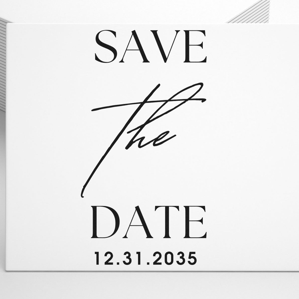 White save-the-date stamp and seal card with black SAVE THE DATE text, script signature, and 12.31.2035 date.