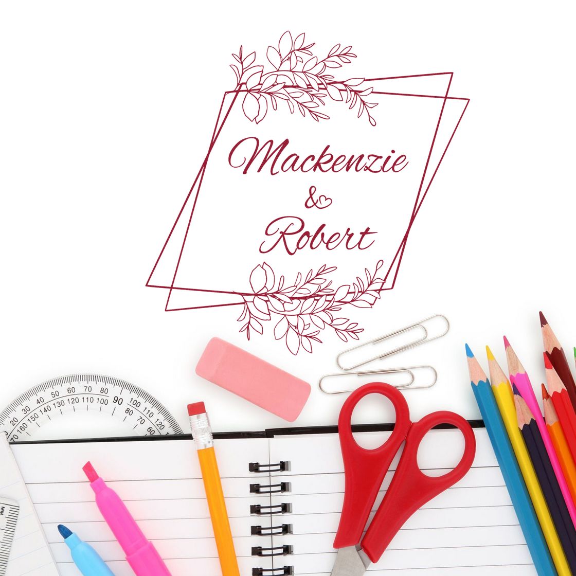 Red custom wedding stamp seal with floral border and Mackenzie & Robert, surrounded by stationery supplies.