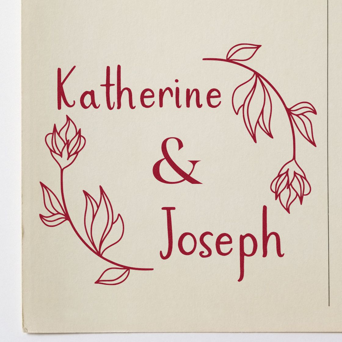 Burgundy custom stamp and seal with Katherine & Joseph, framed by delicate floral line art on cream paper.
