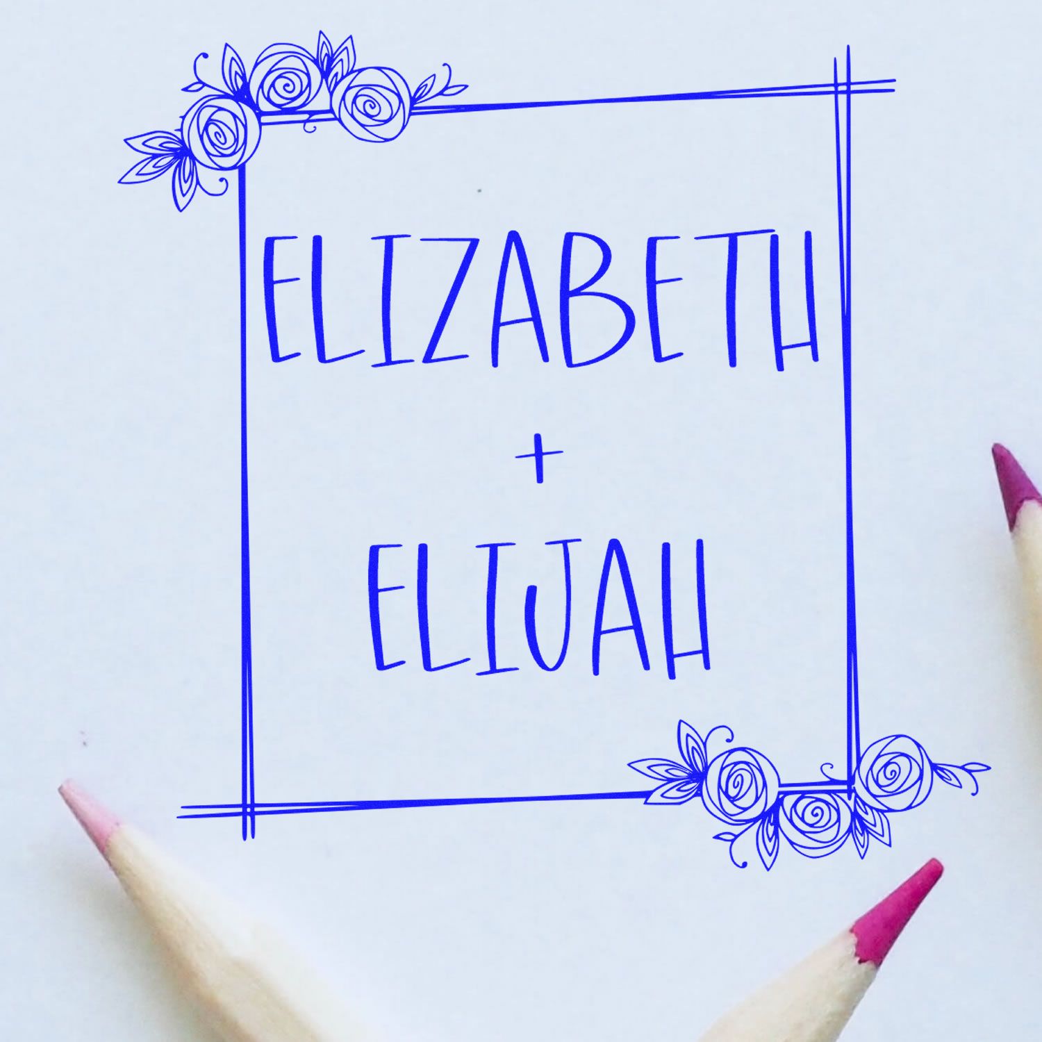 Blue floral stamp and seal design with square border, Elizabeth + Eliyah text, on white paper with pink pencil tips.