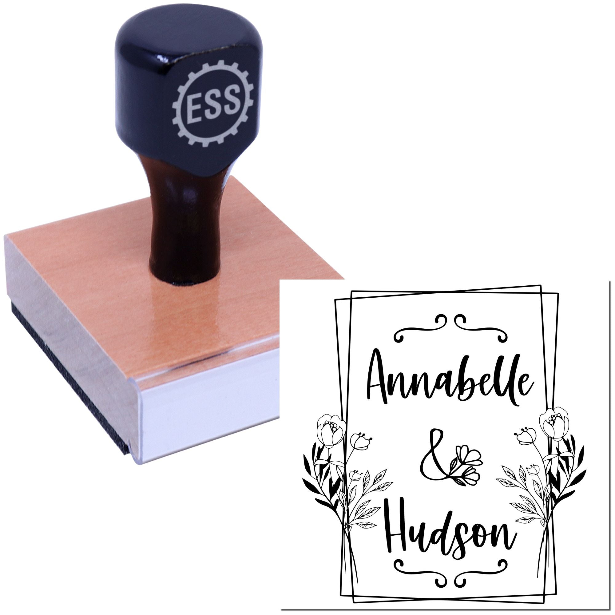 Custom self-inking stamp and seal with navy handle, pink base, and floral monogram for Annabelle Hudson.