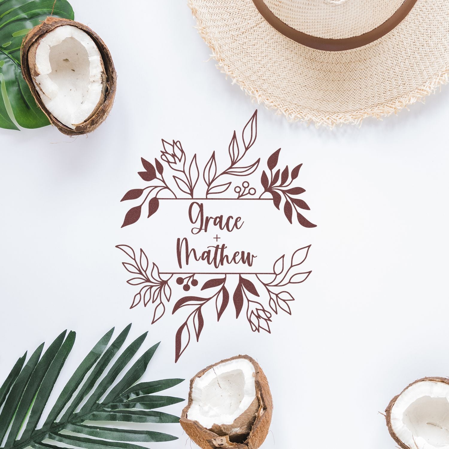 Brown floral wedding stamp seal with Grace + Mathew, framed by tropical leaves, coconuts, and a beige straw hat.
