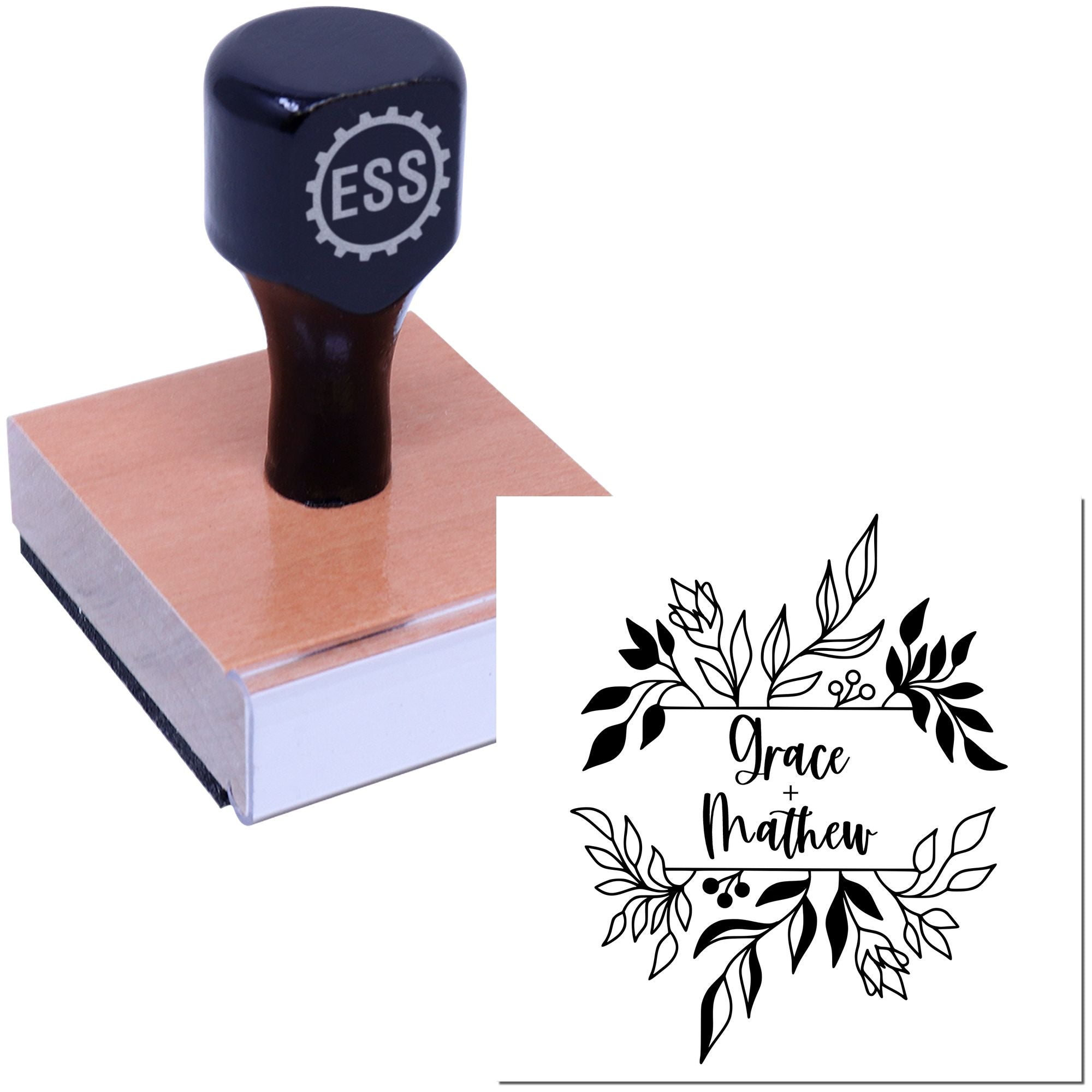 Navy ESS custom stamp on a wooden block, with floral wedding seal reading Grace + Matthew.