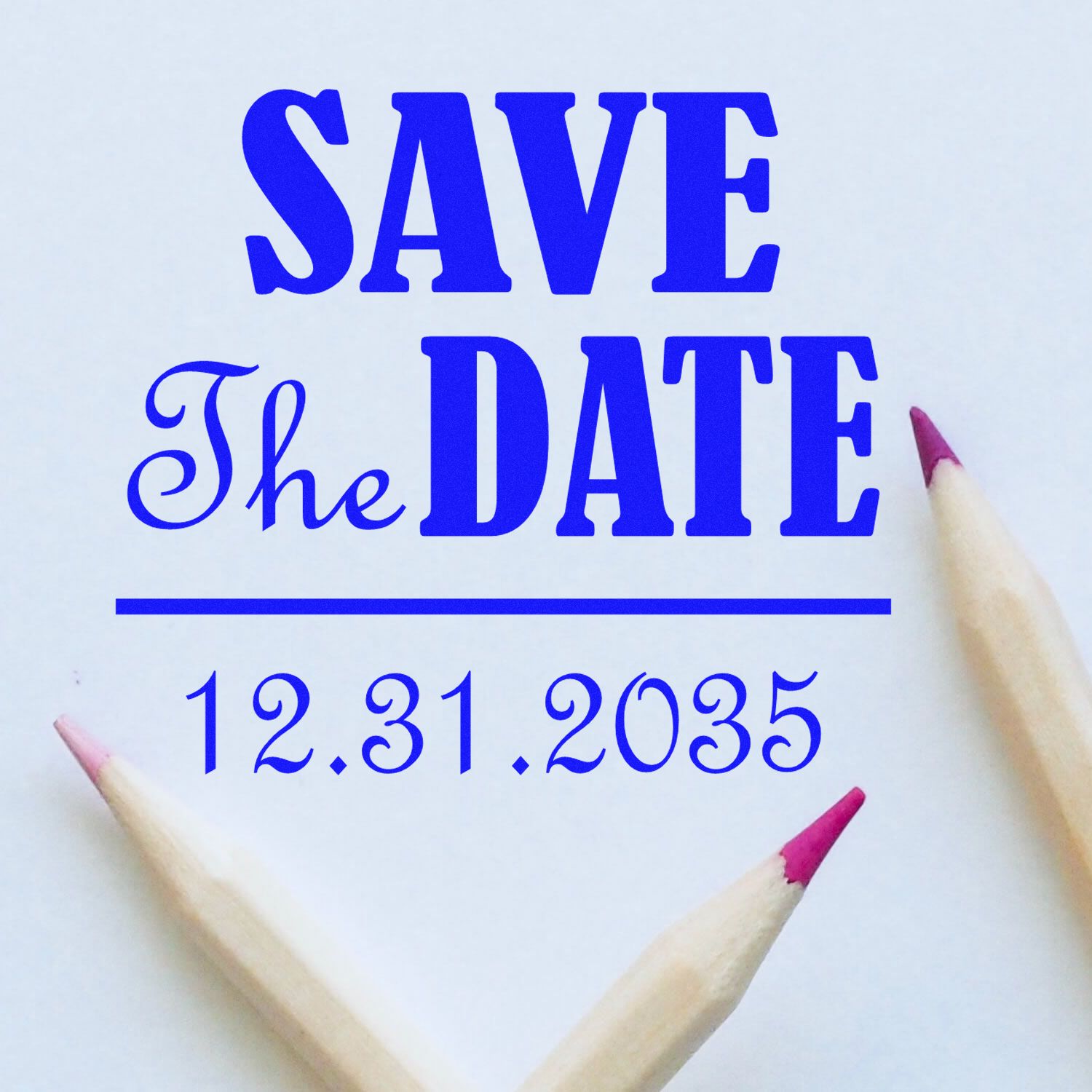 Blue stamp and seal reading SAVE The DATE with date 12.31.2035 on white paper, framed by pink-tipped pencils.